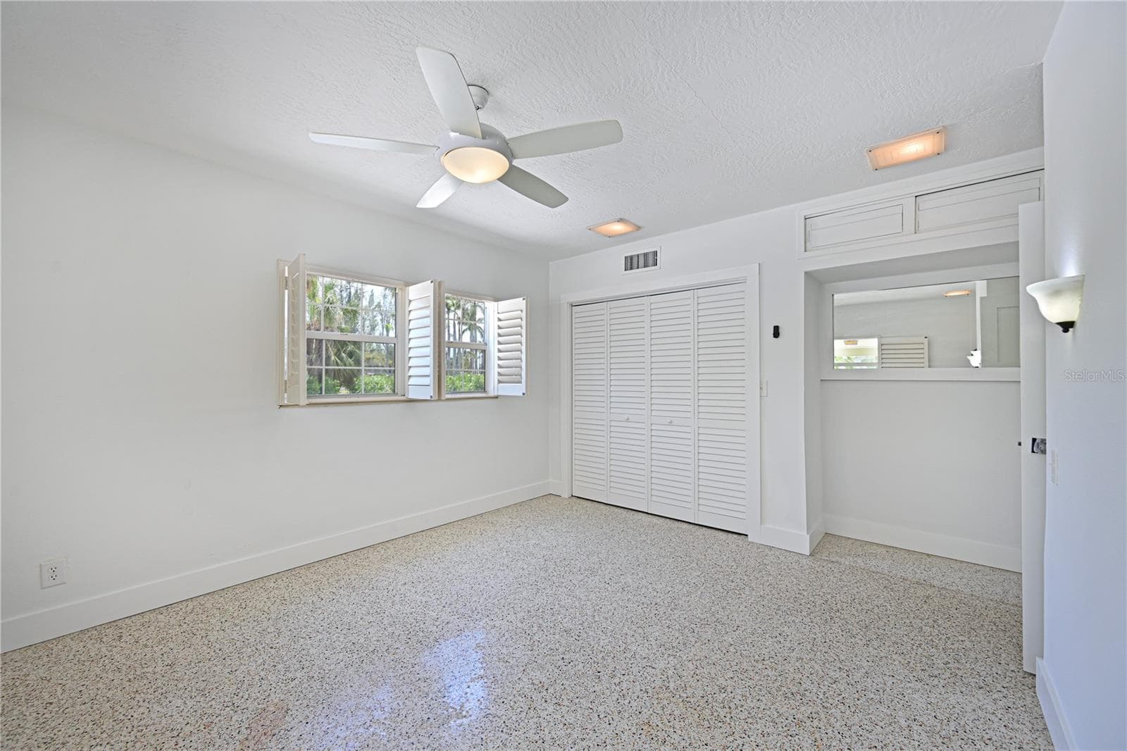 Primary bedroom plantation shutters - 5924 GULF OF MEXICO DR, LONGBOAT KEY