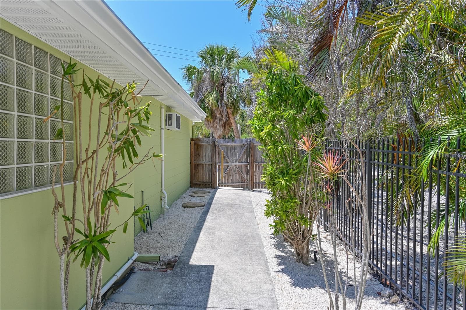 North side of house (glass block window in family room bath) - 5924 GULF OF MEXICO DR, LONGBOAT KEY