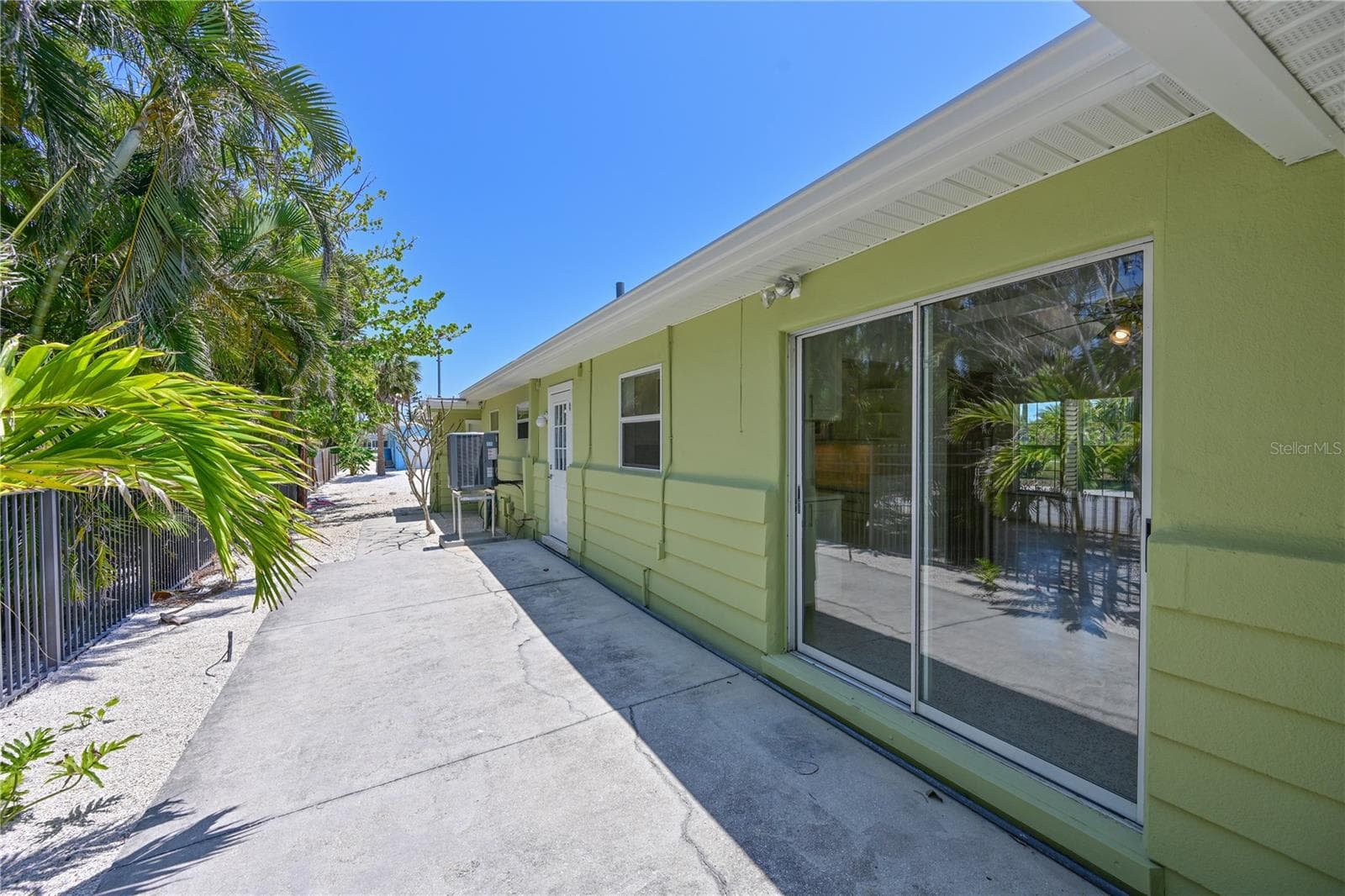 North side of house (sliding door to dining room) - 5924 GULF OF MEXICO DR, LONGBOAT KEY