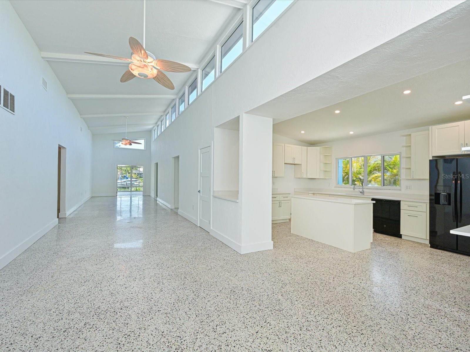 Grand foyer and kitchen island - 5920 GULF OF MEXICO DR, LONGBOAT KEY