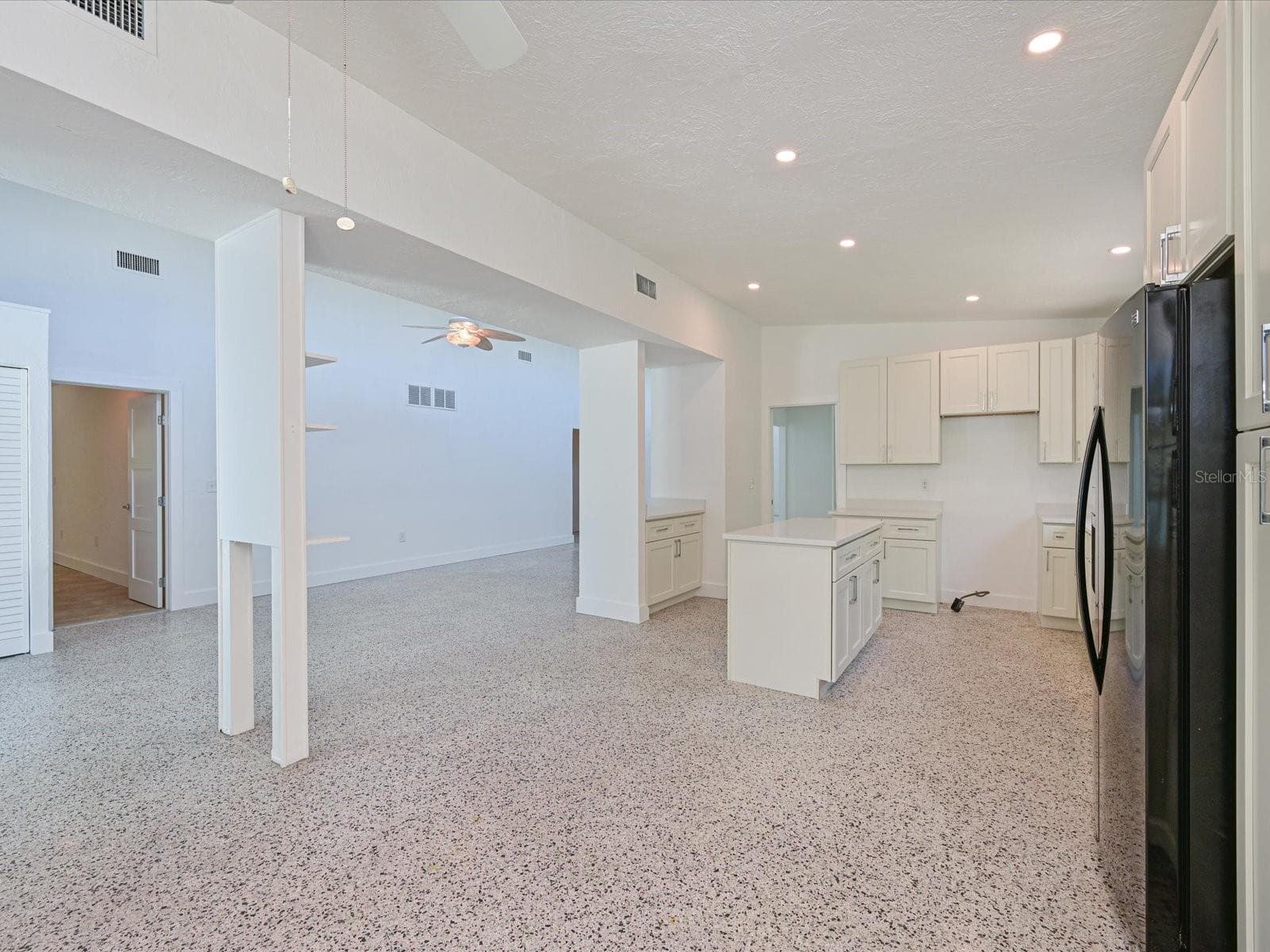 Dining area view of kitchen and foyer - 5920 GULF OF MEXICO DR, LONGBOAT KEY