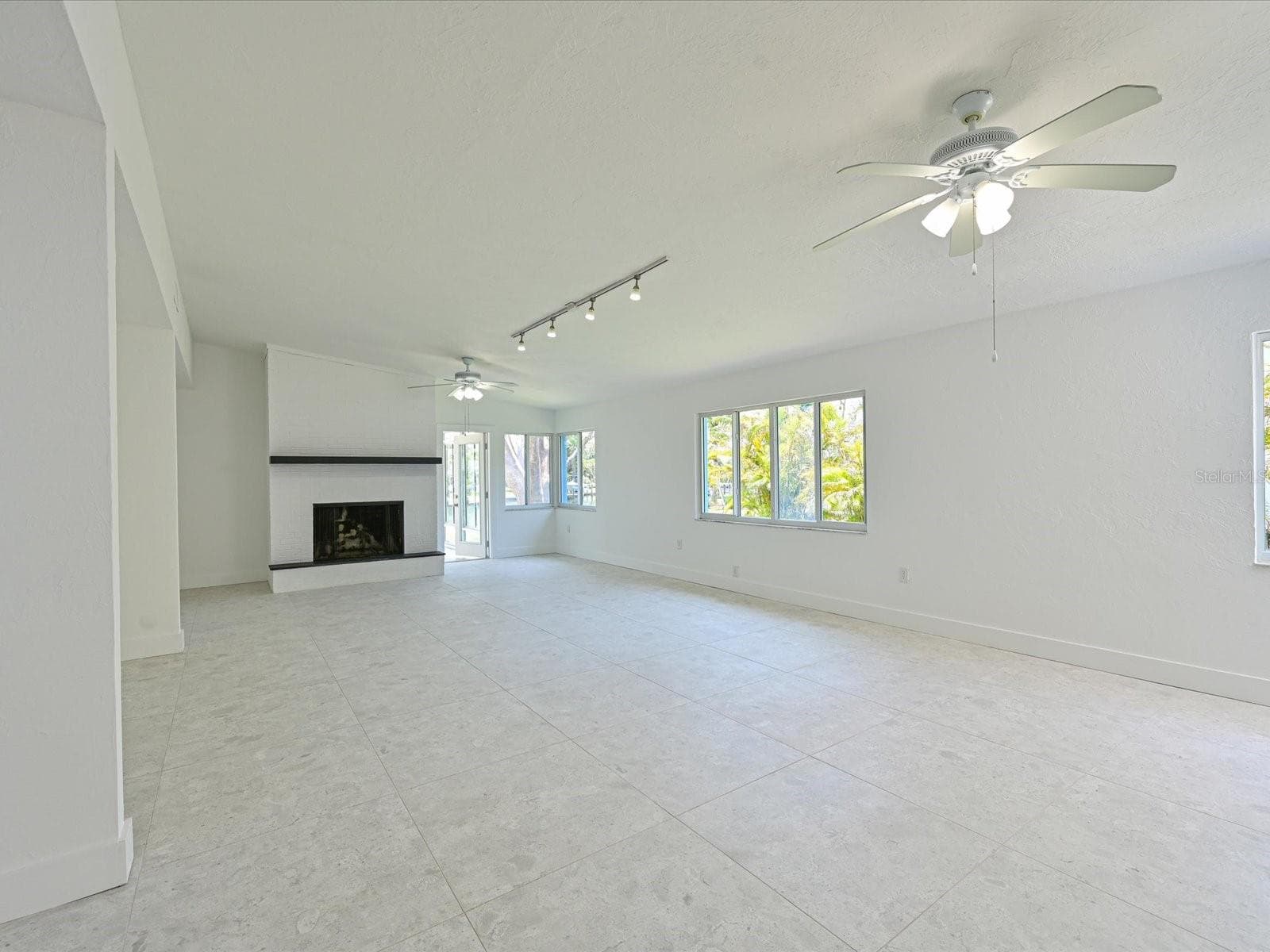 Family room with wood burning fireplace - 5920 GULF OF MEXICO DR, LONGBOAT KEY