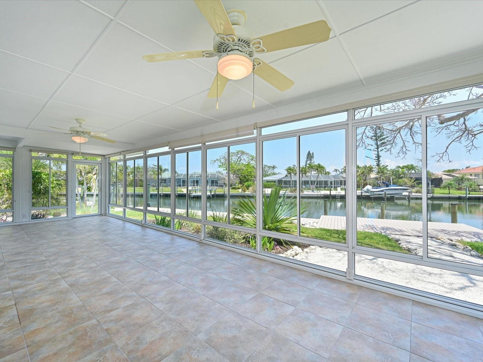 Enclosed lanai with canal view - 5920 GULF OF MEXICO DR, LONGBOAT KEY