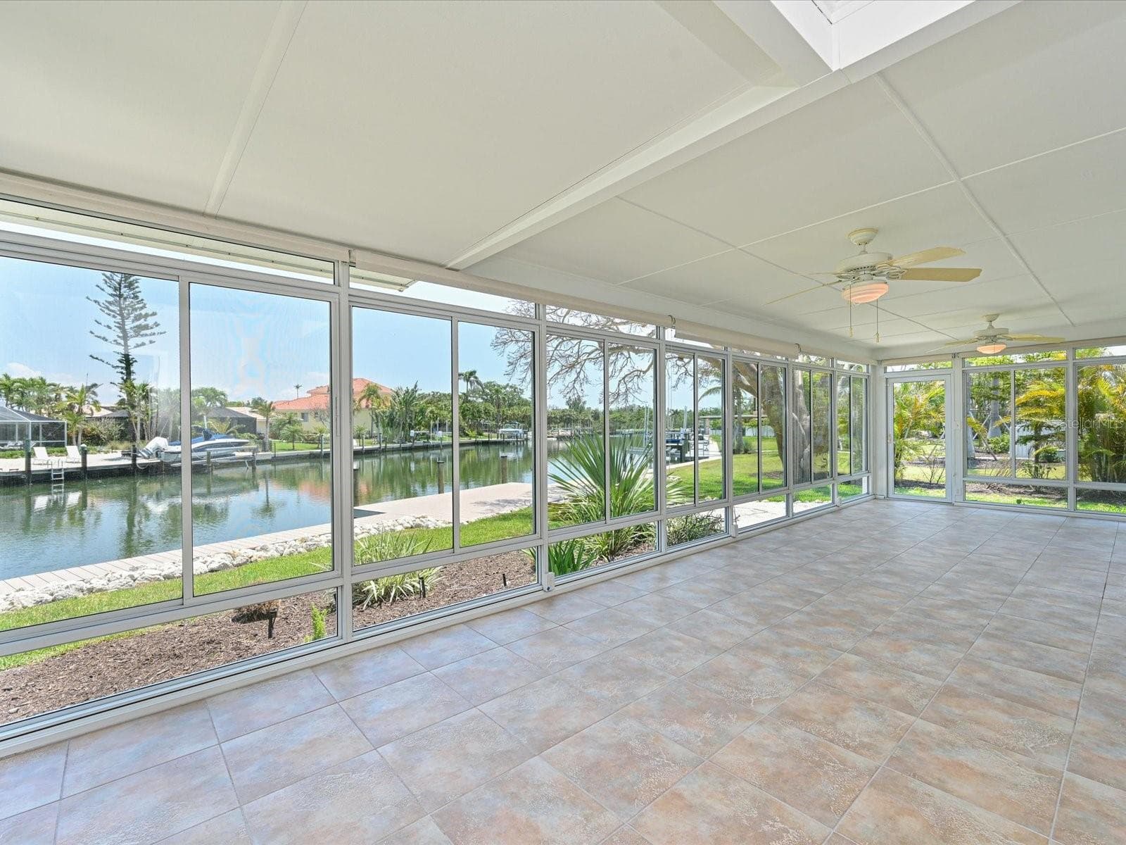 Enclosed lanai with canal view - 5920 GULF OF MEXICO DR, LONGBOAT KEY