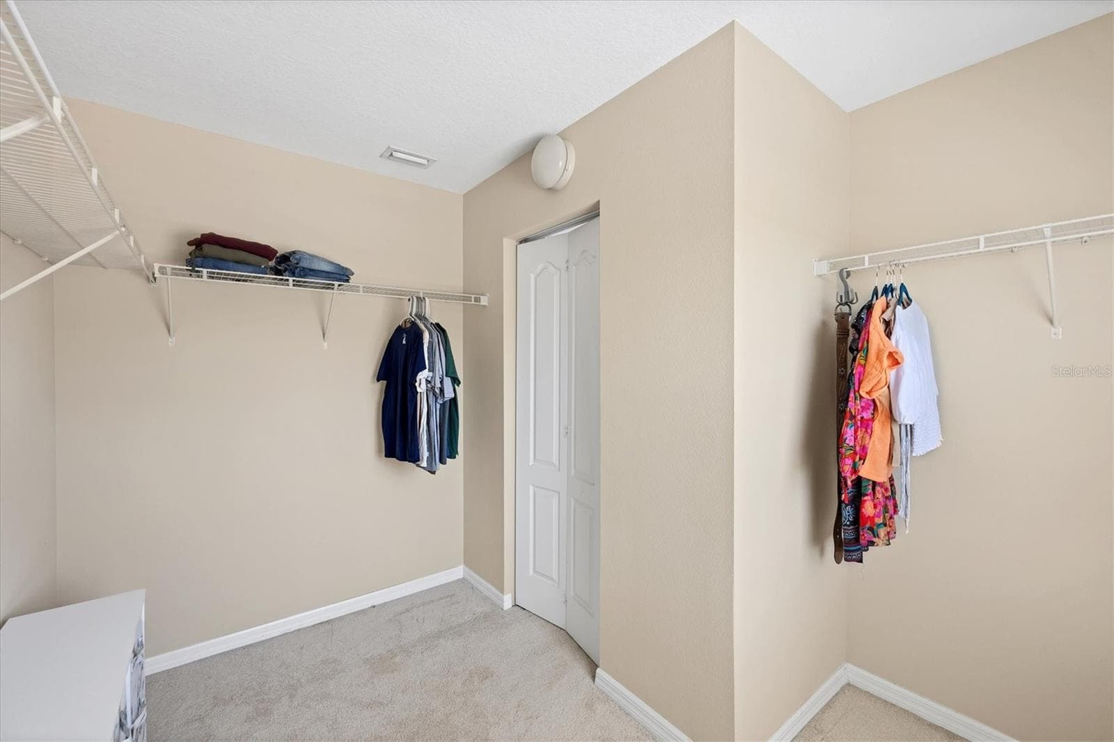 Primary suite walk in closet - 4811 WOODBROOK DR, SARASOTA