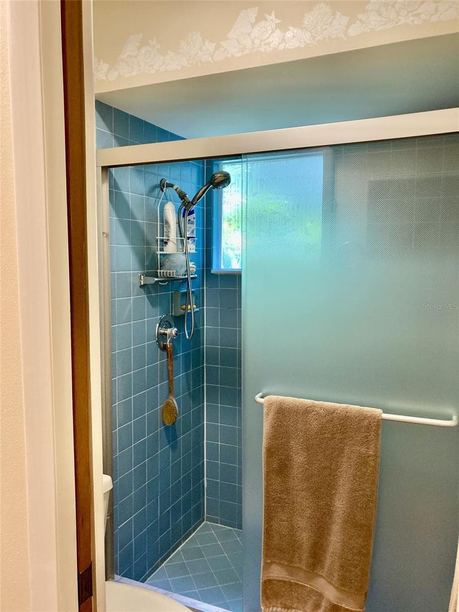 Walk-in shower with nice doors. - 3407 AVENIDA MADERA #A, BRADENTON