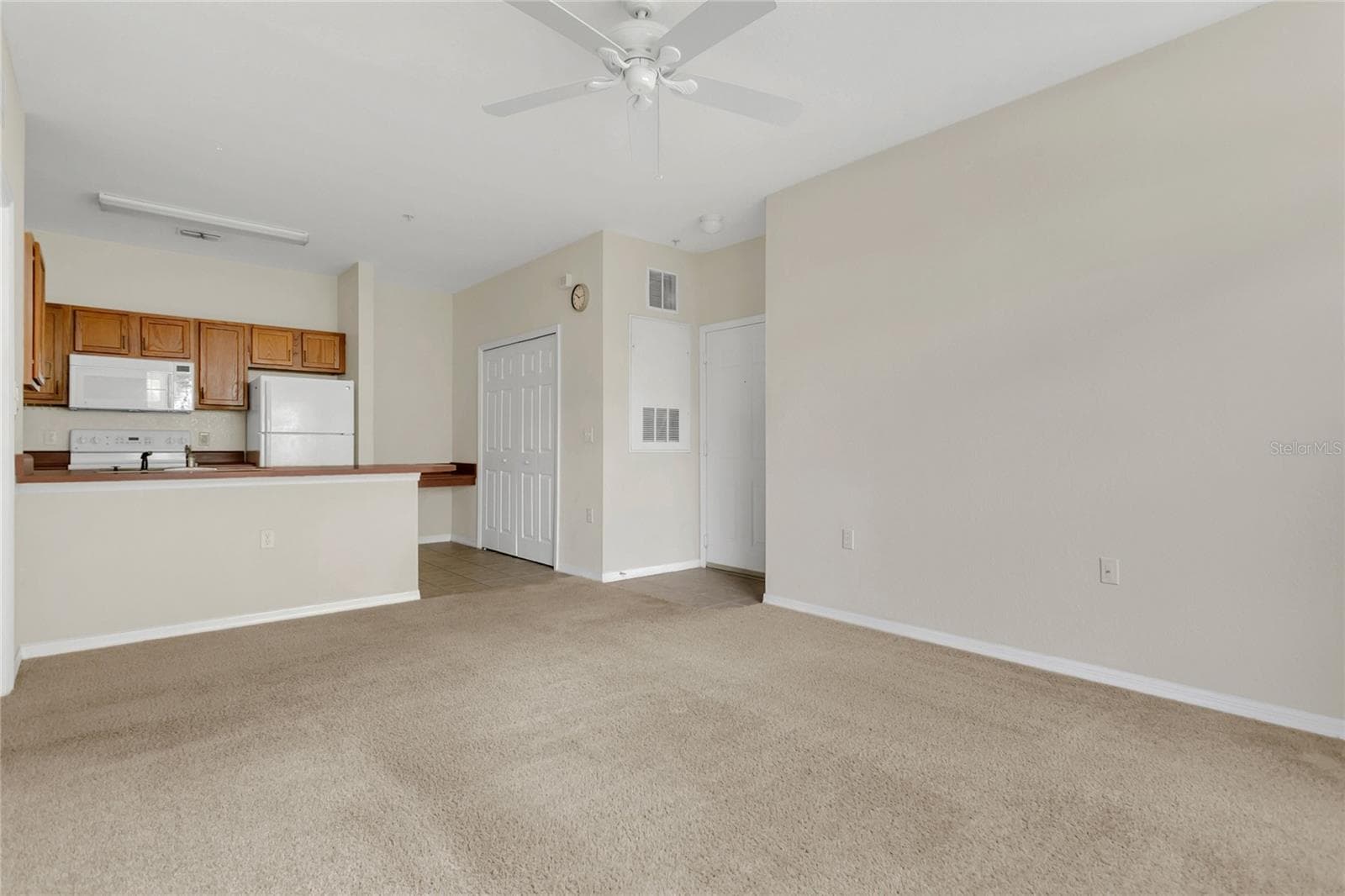 Kitchen and front door from living room - 8213 CLAIRE ANN DR #108, ORLANDO
