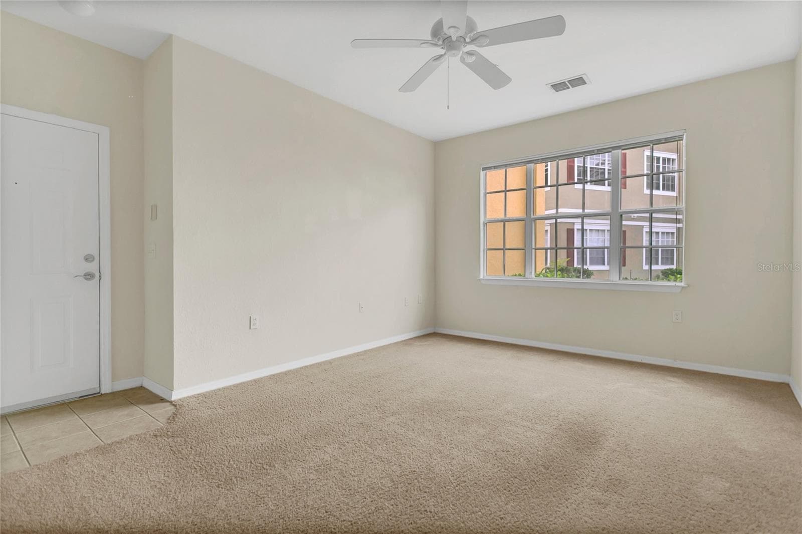 Living room overlooking playground - 8213 CLAIRE ANN DR #108, ORLANDO