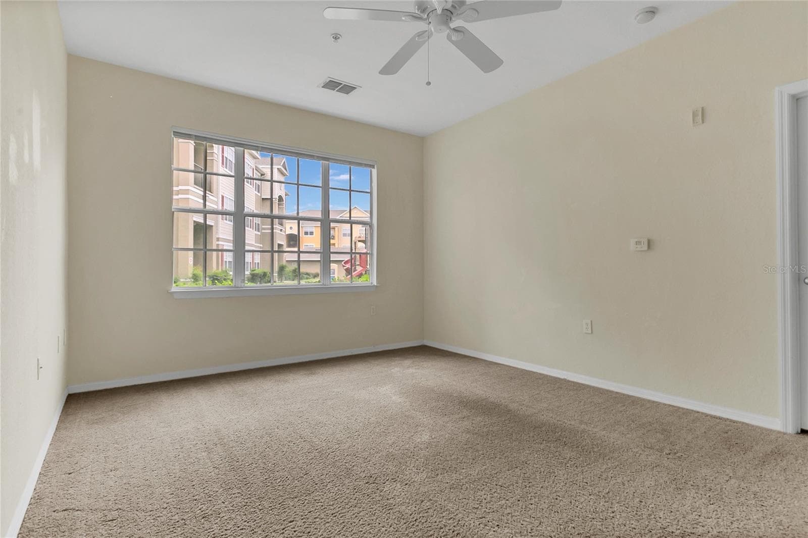 Living room view overlooking playground - 8213 CLAIRE ANN DR #108, ORLANDO