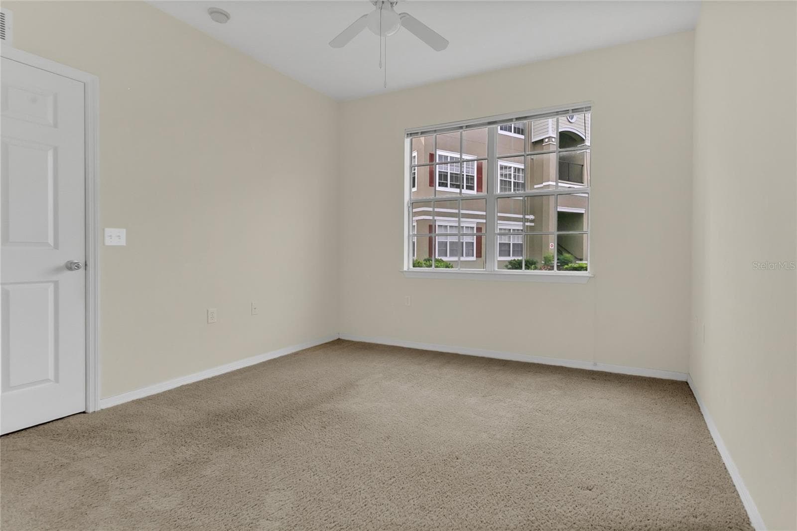 Bedroom with with window - 8213 CLAIRE ANN DR #108, ORLANDO