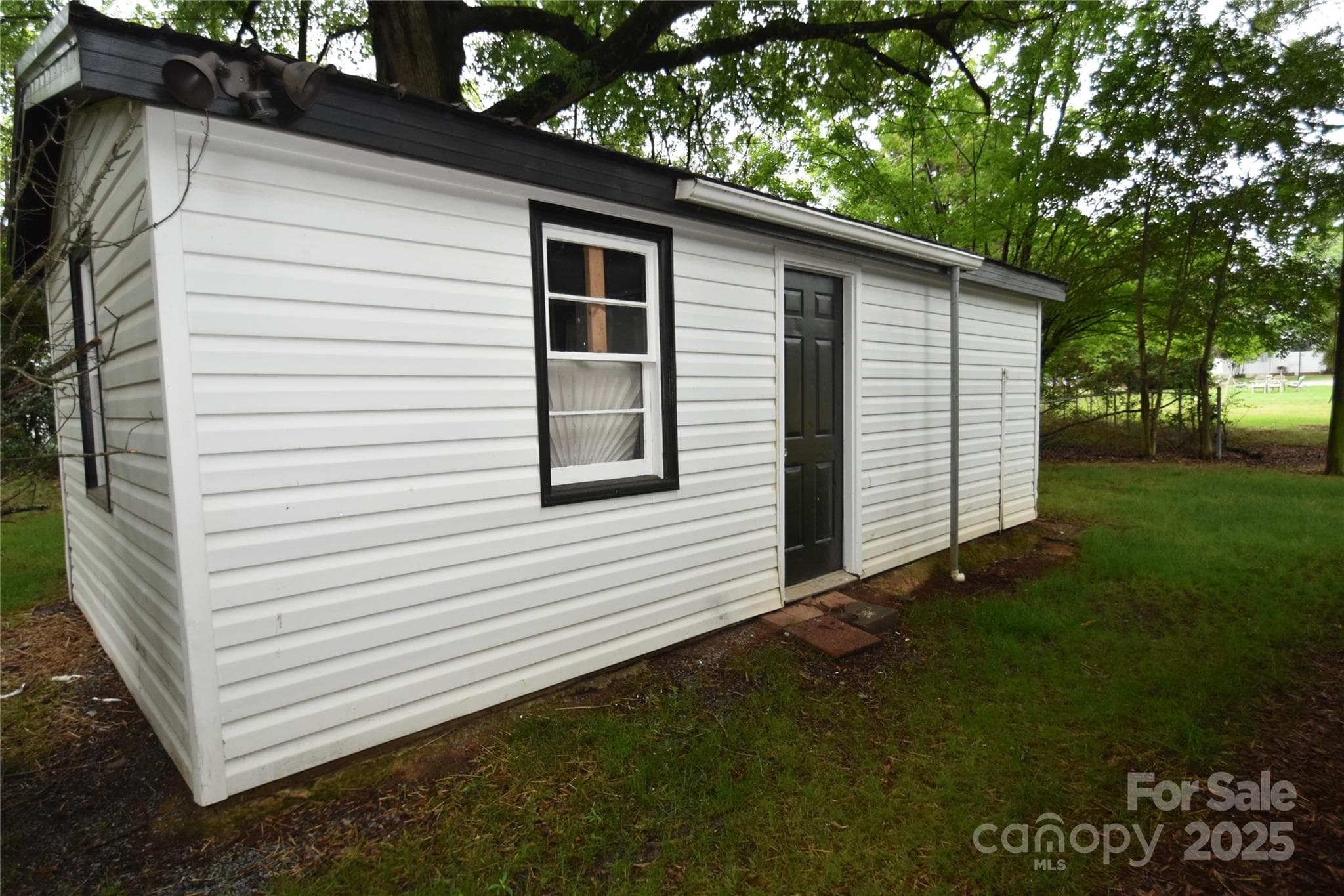 The "what ever you wanna call it" Shed. A bit cluttered at the time. It's wired, walled for smaller room w/h second entry door. Lots of possibilities! - 706 Mcintyre Street, Monroe