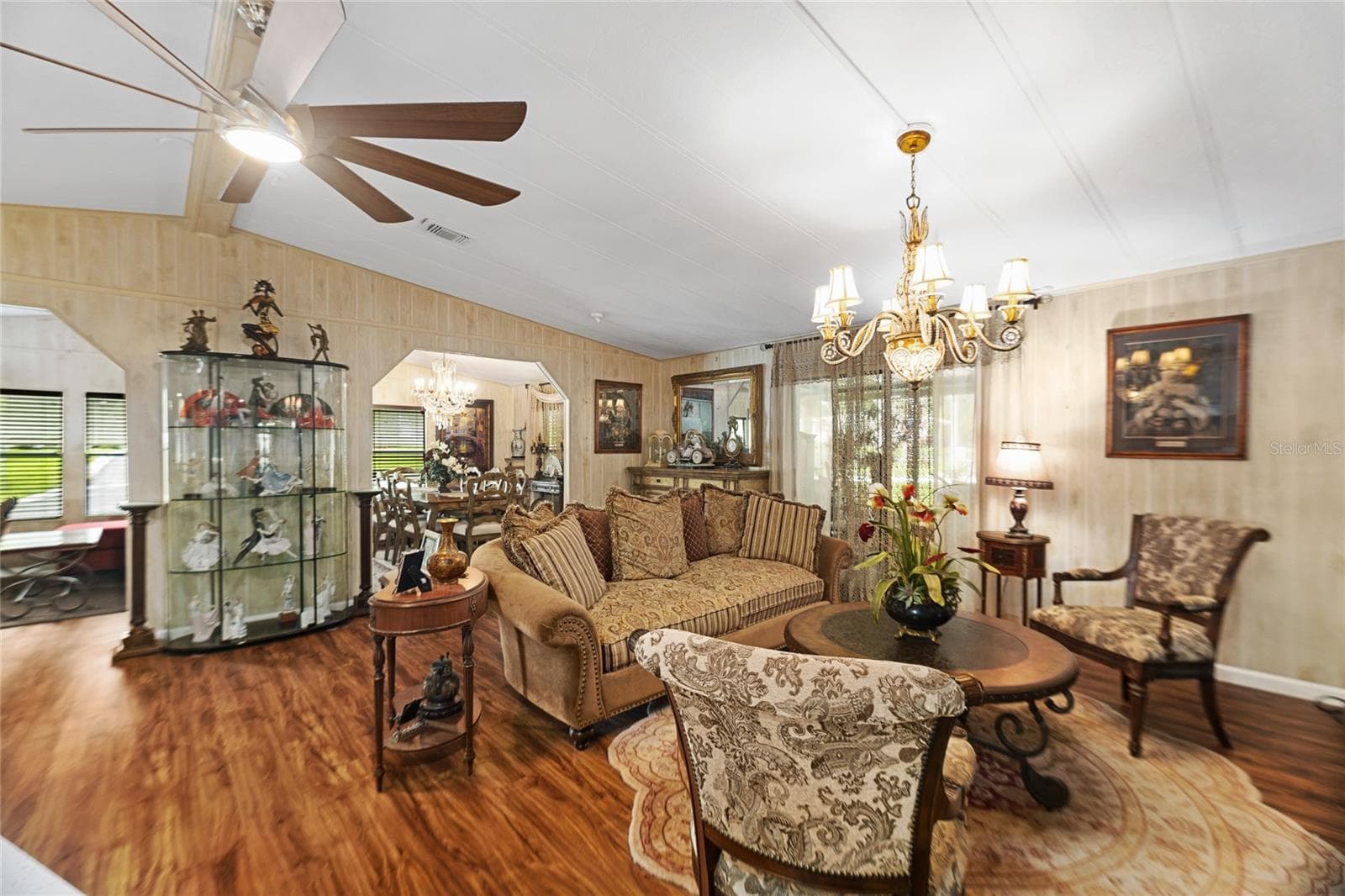Living room open to family/front room space offers excellent entertaining options! - 2002 S CITRUS CIR #1728, ZELLWOOD
