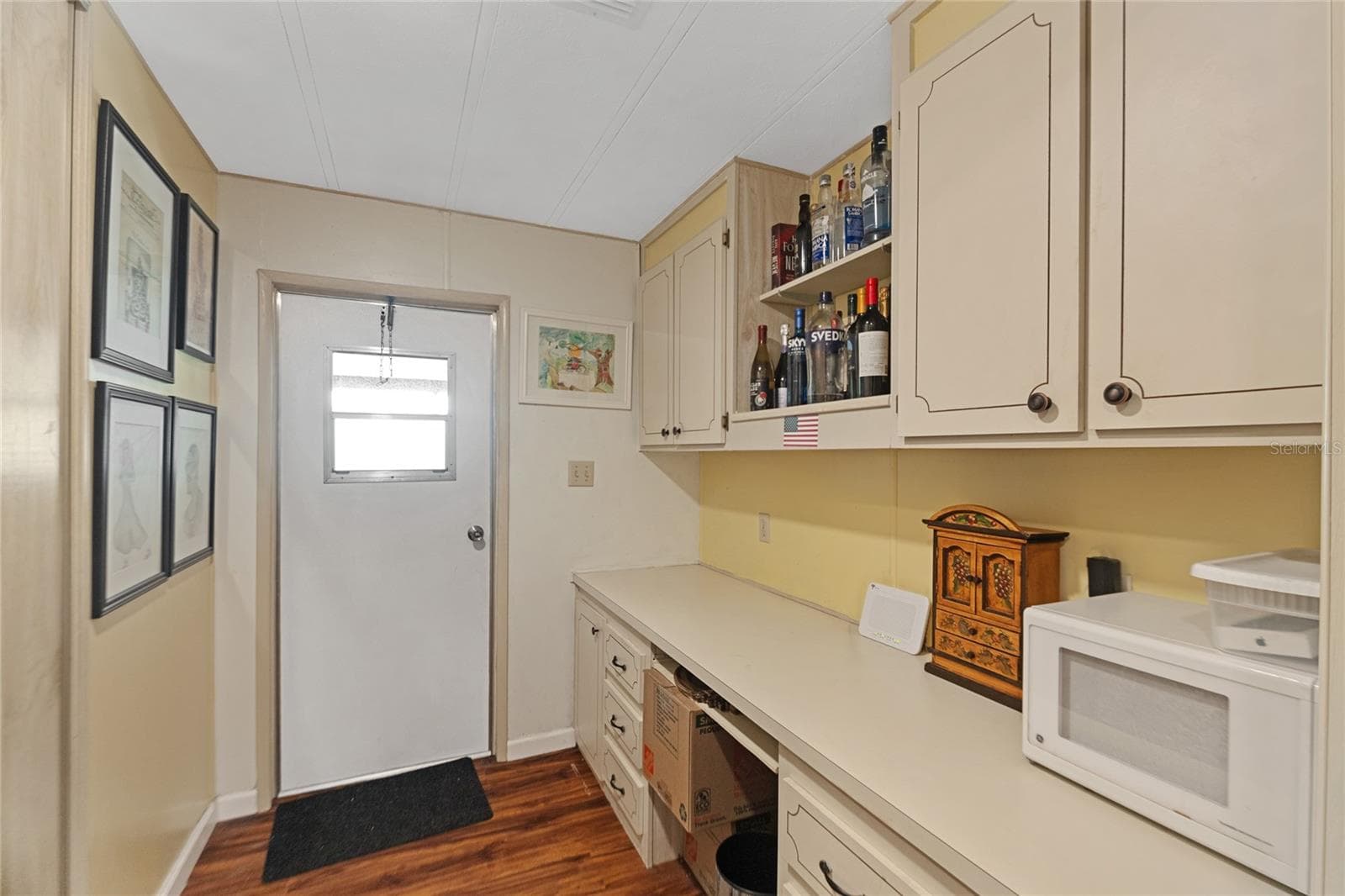 Office with built-in desk and cabinetry - 2002 S CITRUS CIR #1728, ZELLWOOD