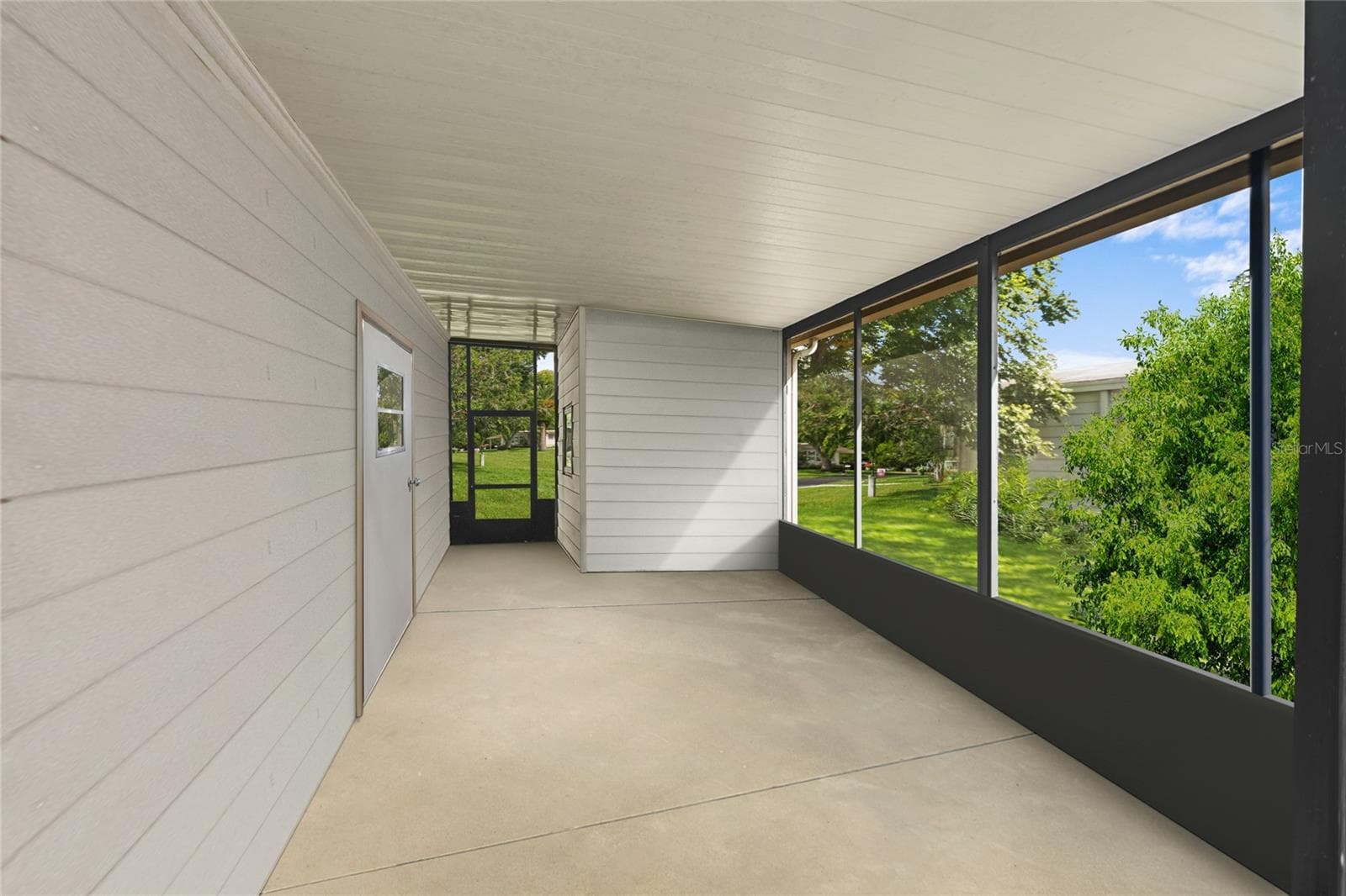 2nd screened patio (Image not showing steps when digitally altered to remove seller's items) - 2002 S CITRUS CIR #1728, ZELLWOOD