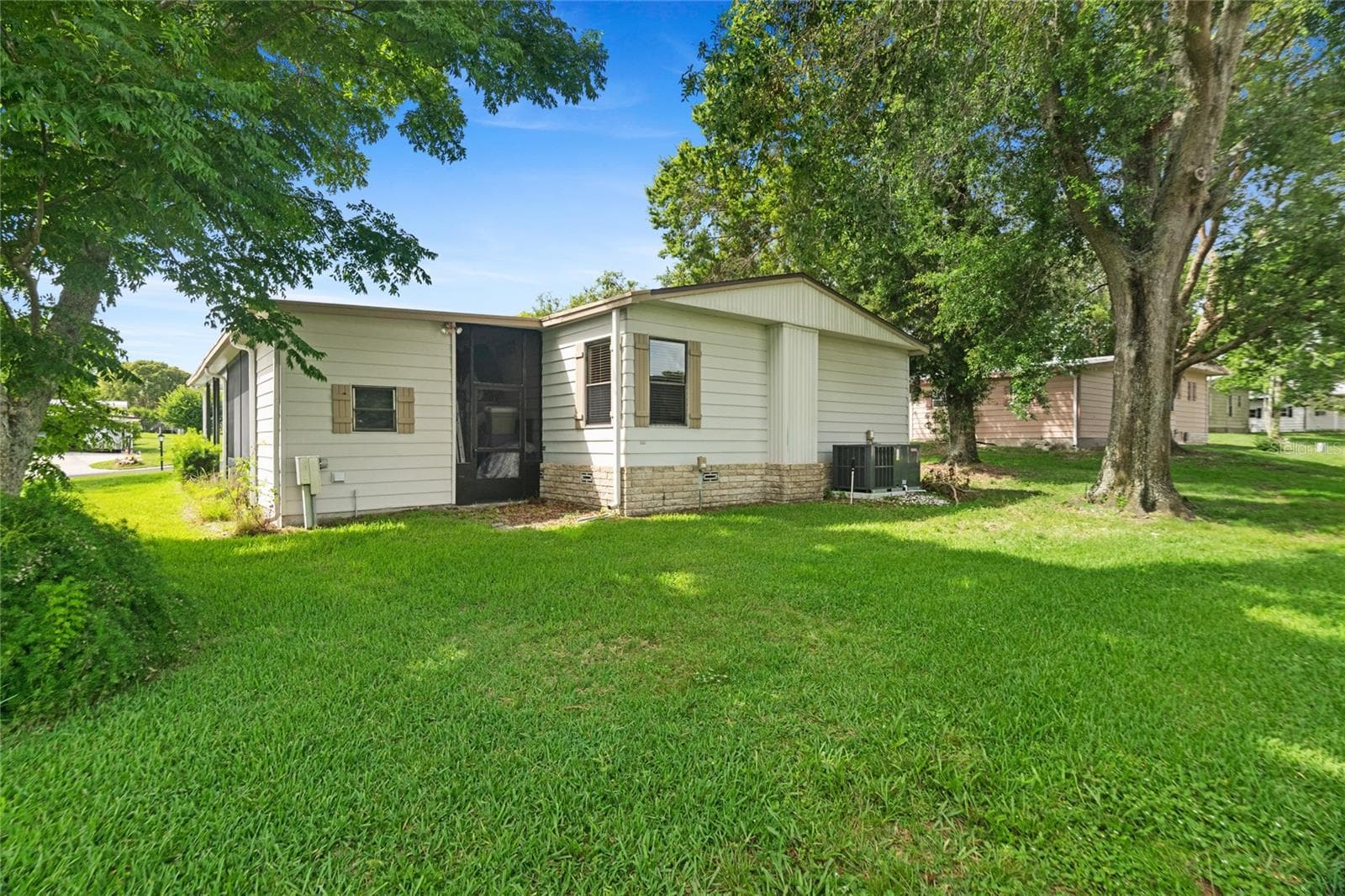 Rear of home, laundry room, new AC! - 2002 S CITRUS CIR #1728, ZELLWOOD