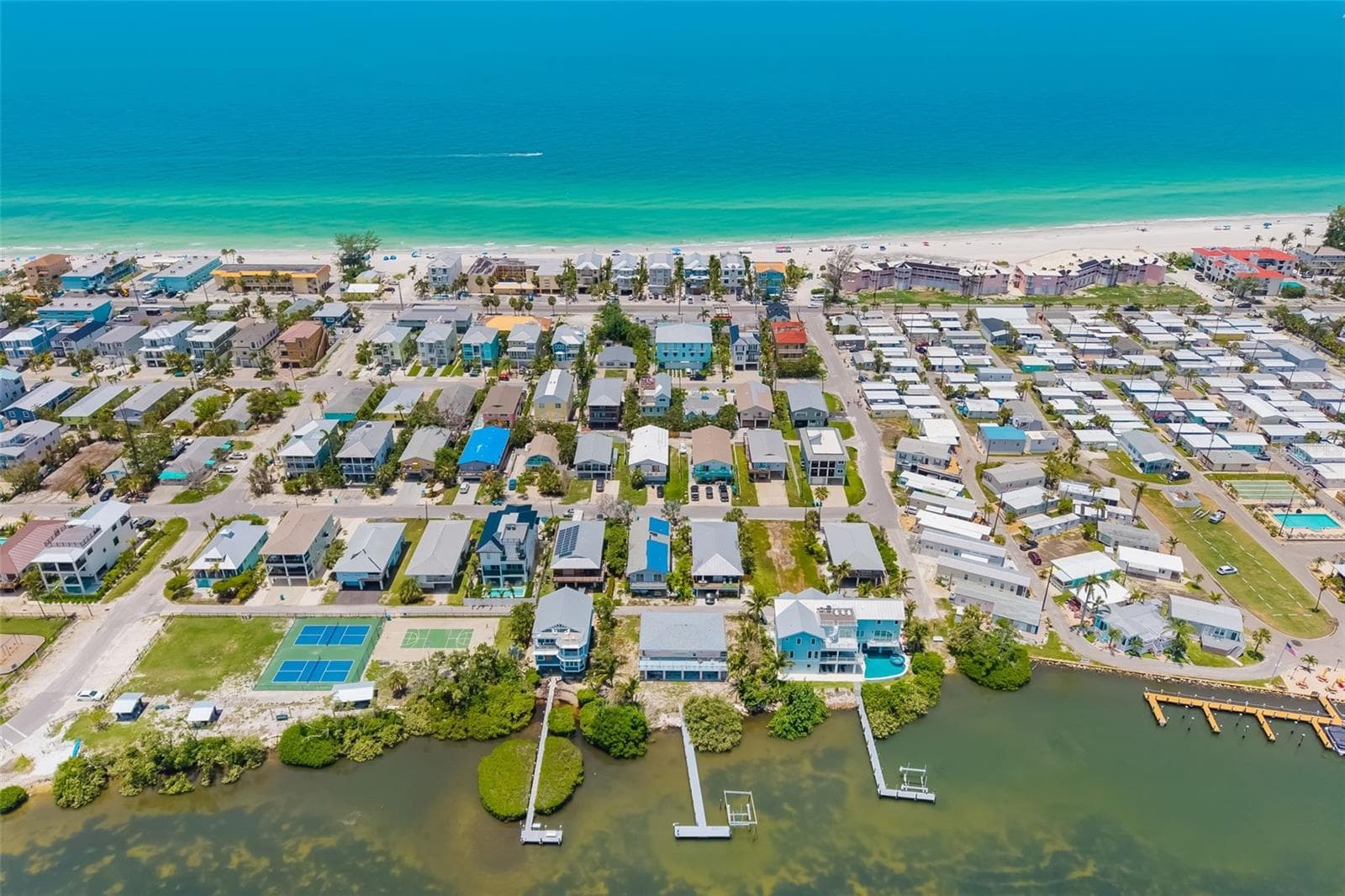 Aerial – Gulf Side OverviewAerial view showcasing proximity to the Gulf of Mexico and surrounding beachside homes. - 2513 AVENUE B #B, BRADENTON BEACH