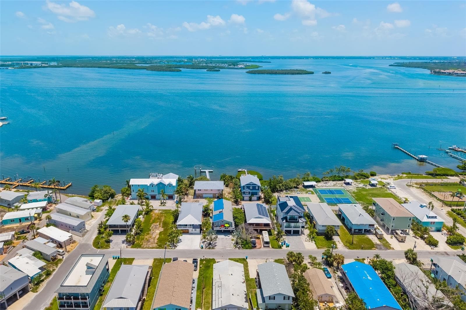 Aerial – Bay Side ViewAerial perspective highlighting close access to Sarasota Bay and waterfront amenities. - 2513 AVENUE B #B, BRADENTON BEACH