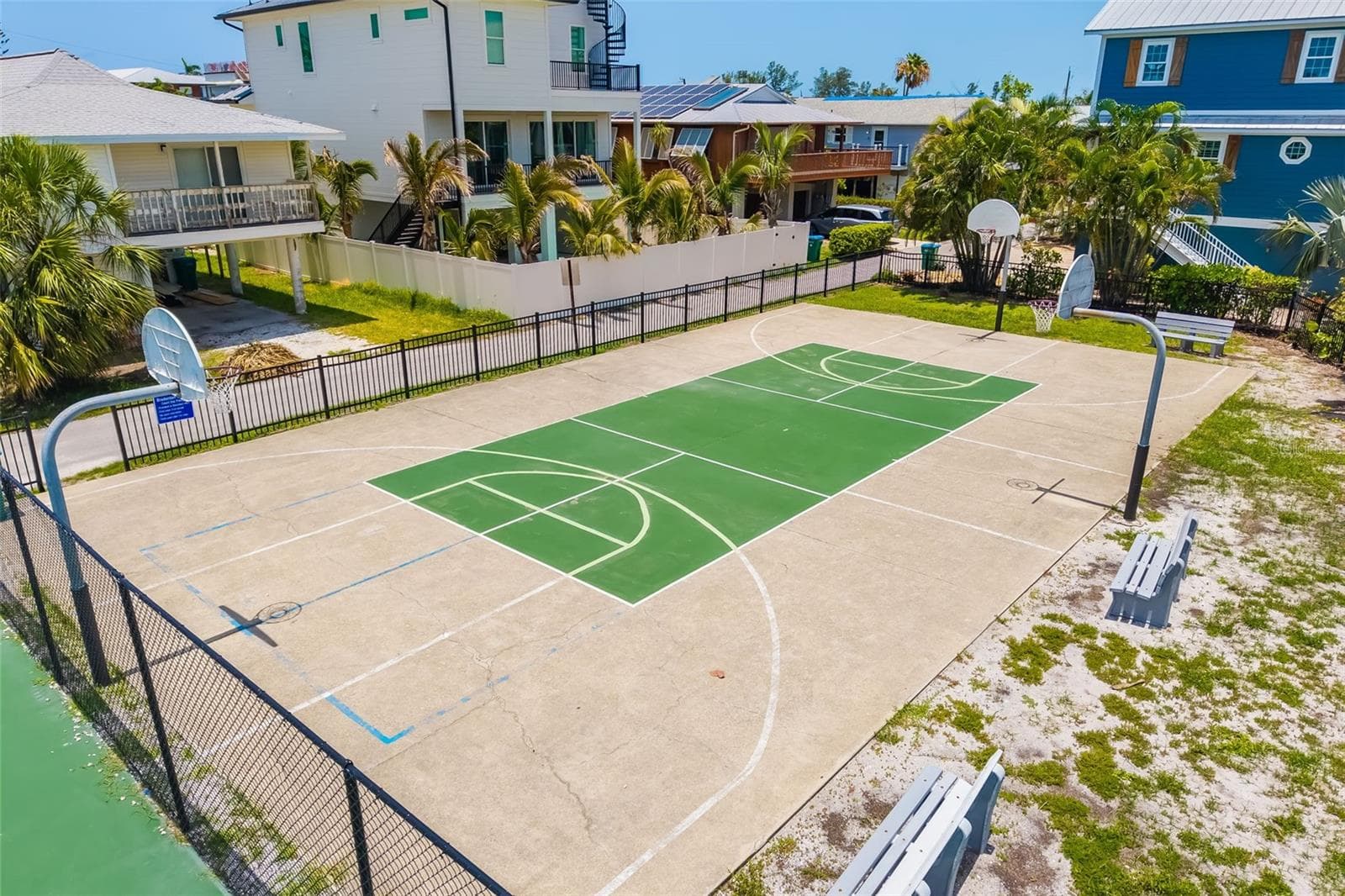 Community basketball court offering additional outdoor recreation just moments from the home. - 2513 AVENUE B #B, BRADENTON BEACH