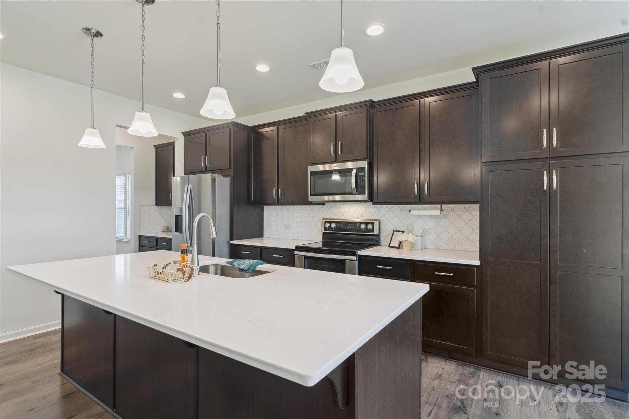 Huge upgraded island, soft close cabinets and a dual oven! - 117 Carmine Court, Troutman