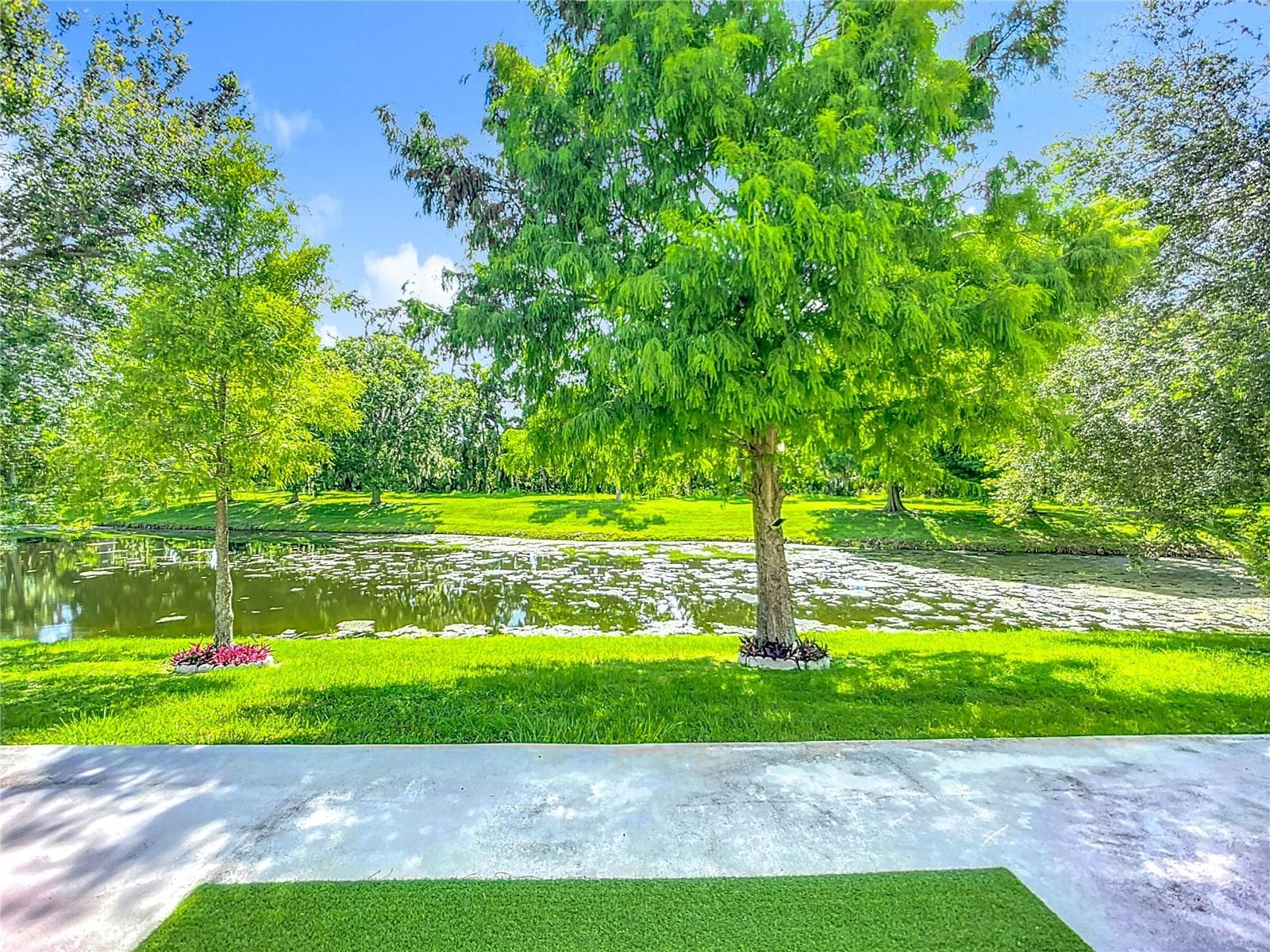 Backyard with a permit view of the pond. - 3409 61ST TER E, ELLENTON