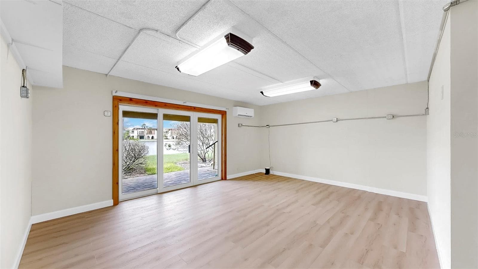 Ground Floor Bonus Room with BRAND NEW Vinyl Plank Flooring - 459 HAVEN POINT DR, TREASURE ISLAND
