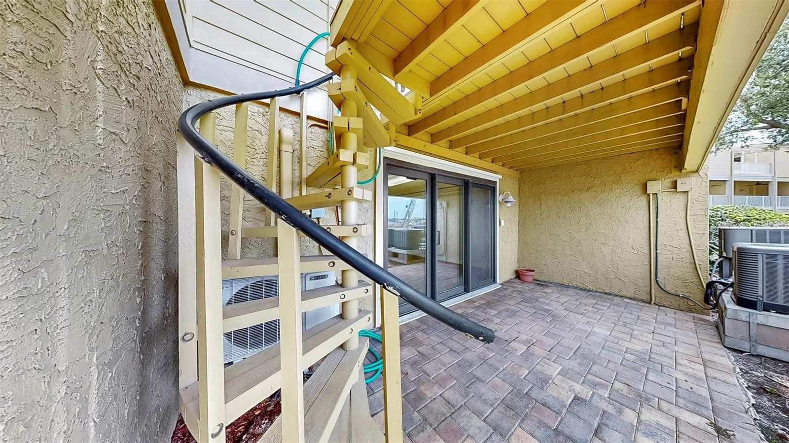 Ground Floor Spiral Staircase to 2nd Floor Balcony - 459 HAVEN POINT DR, TREASURE ISLAND