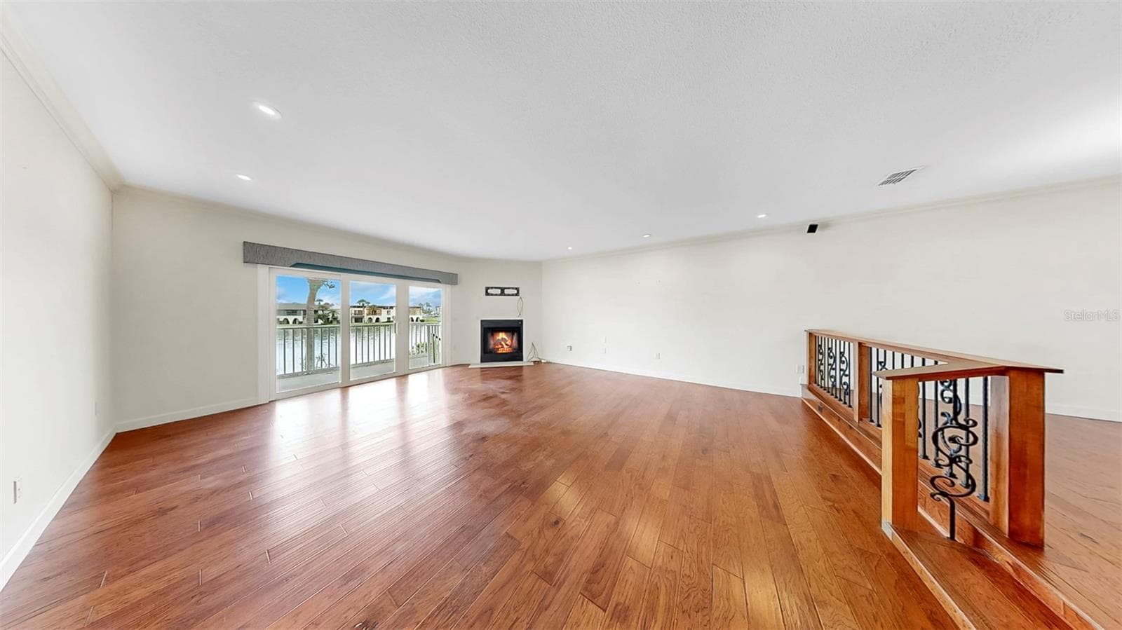 Living Room with Wood-Burning Fireplace - 459 HAVEN POINT DR, TREASURE ISLAND