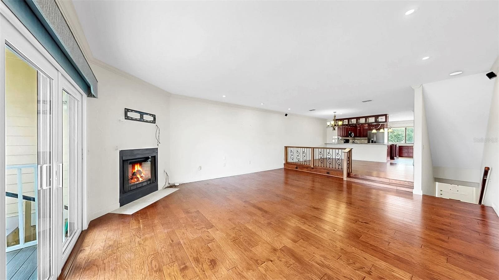 Living Room with Wood-Burning Fireplace - 459 HAVEN POINT DR, TREASURE ISLAND