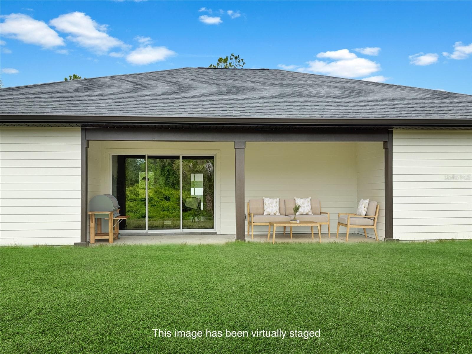 Rear Elevation featuring Covered Lanai - 73 BARSTOW ST, PORT CHARLOTTE
