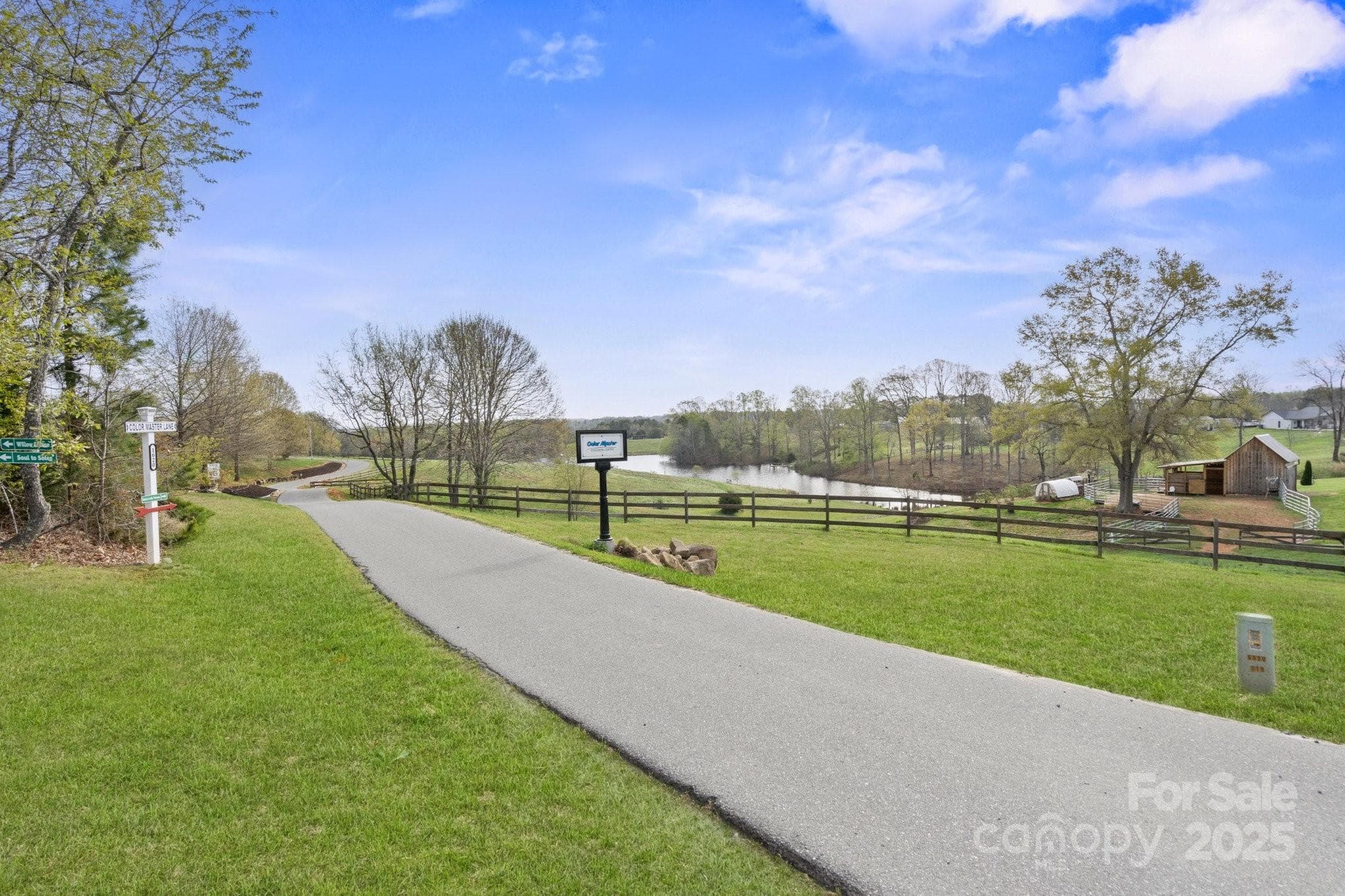 Picturesque, windy private street leads to the estate. - Mooresville