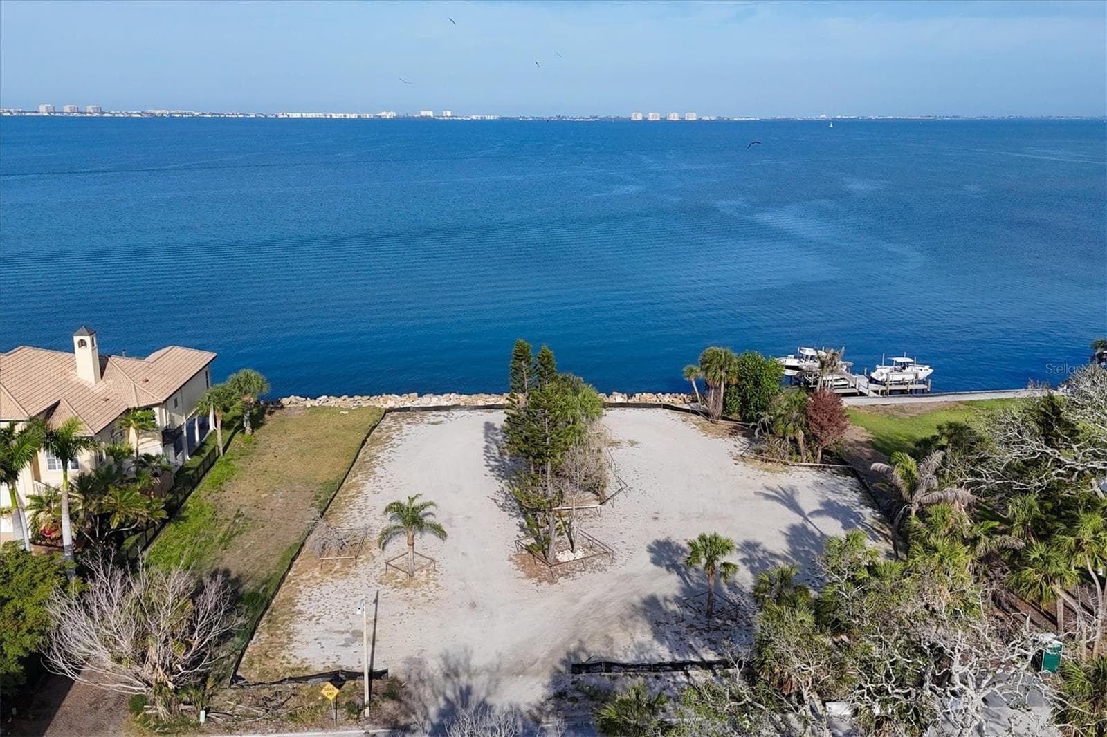 Lot lines extend beyond black silt fence - 603 INDIAN BEACH LN, SARASOTA