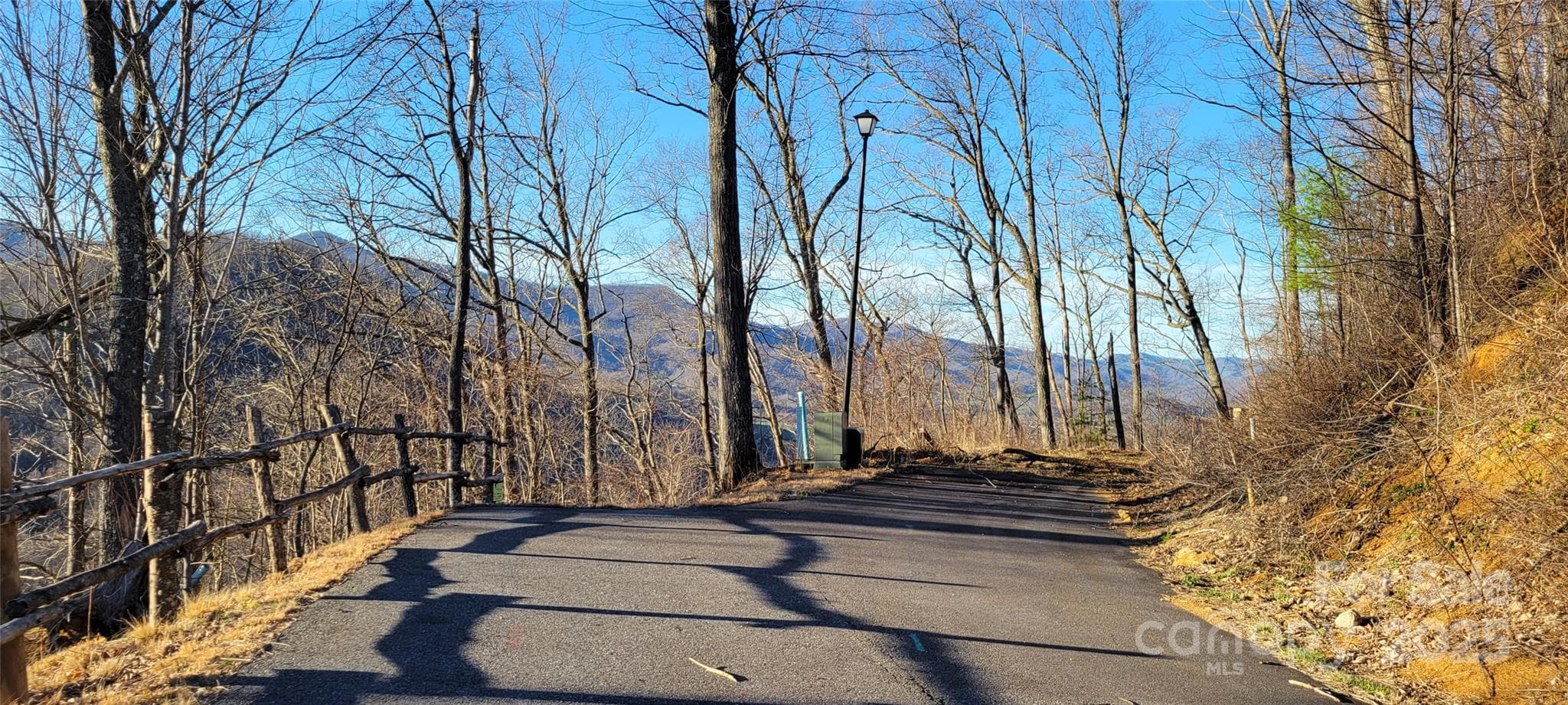 SW view of Holiday Dr. Lot starts at end of pavement - Waynesville