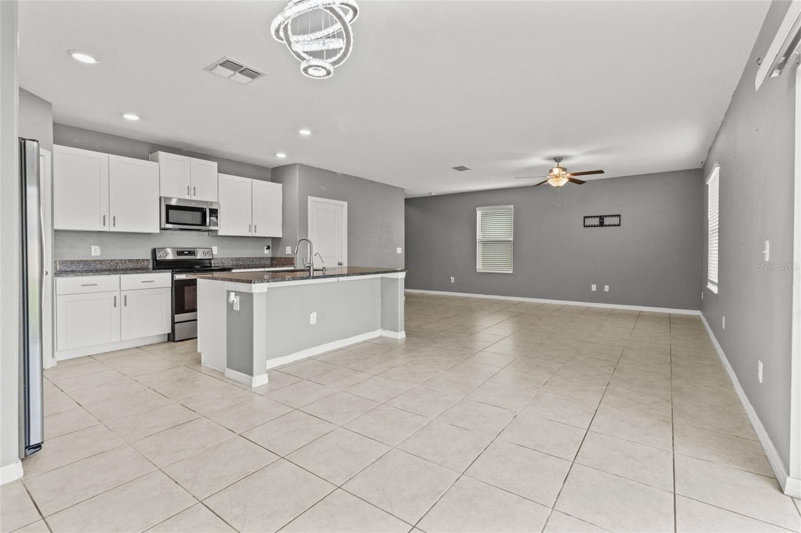 Open layout of the Kitchen, Dining and Living Room - 16671 KINGMAN REEF ST, WIMAUMA