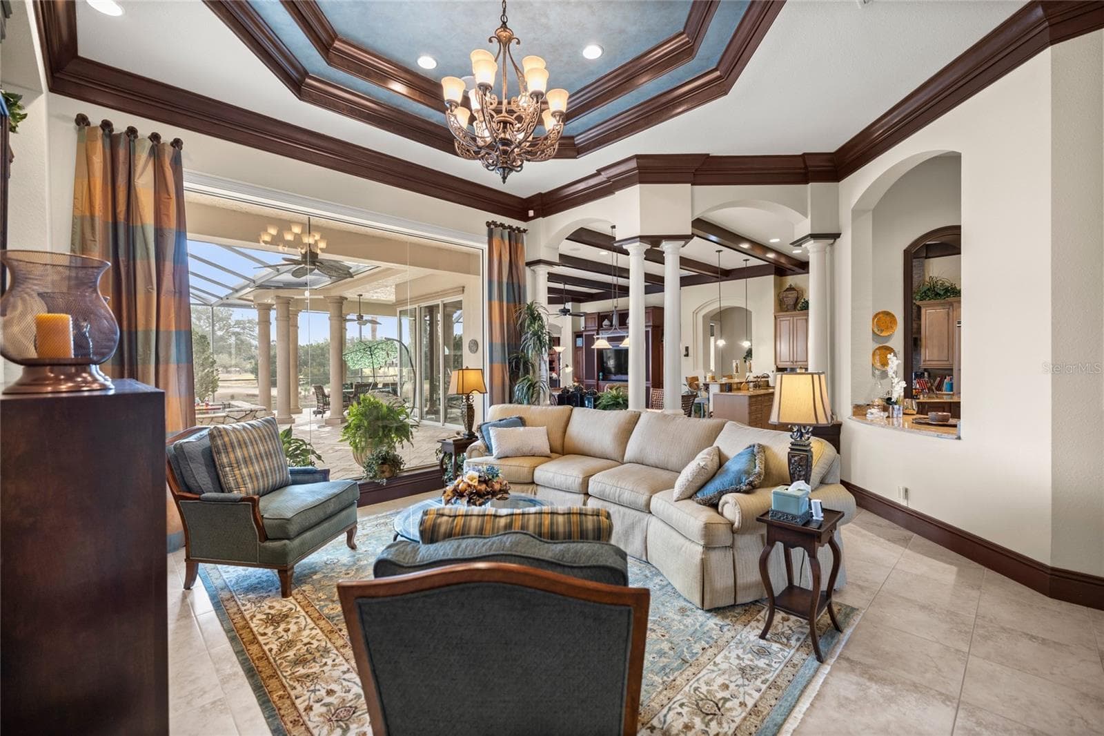 Formal living room overlooking pool and golf course - 6861 SW 179TH AVENUE RD, DUNNELLON