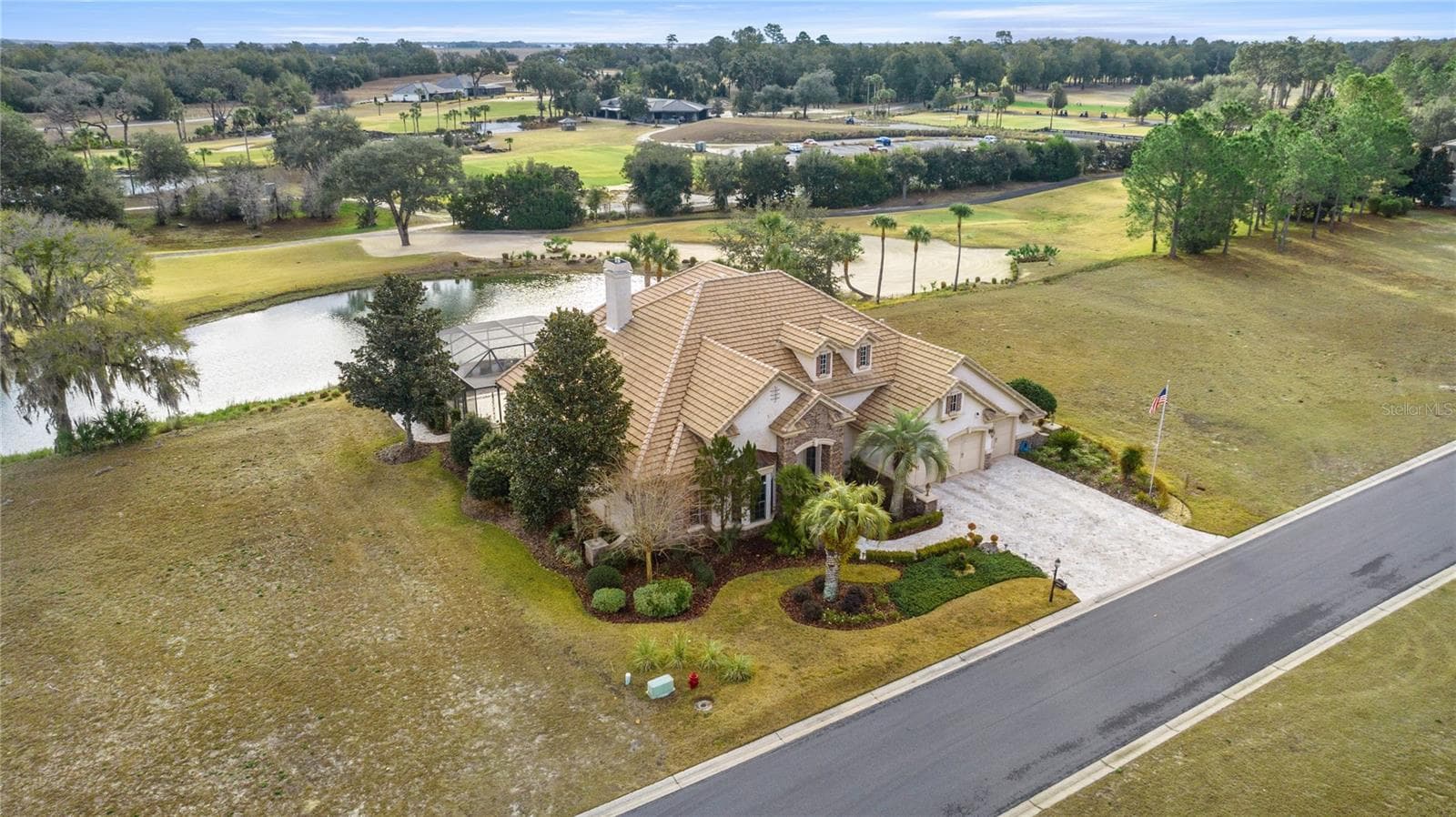 Front aerial view of home overlooking water and the golf course - 6861 SW 179TH AVENUE RD, DUNNELLON