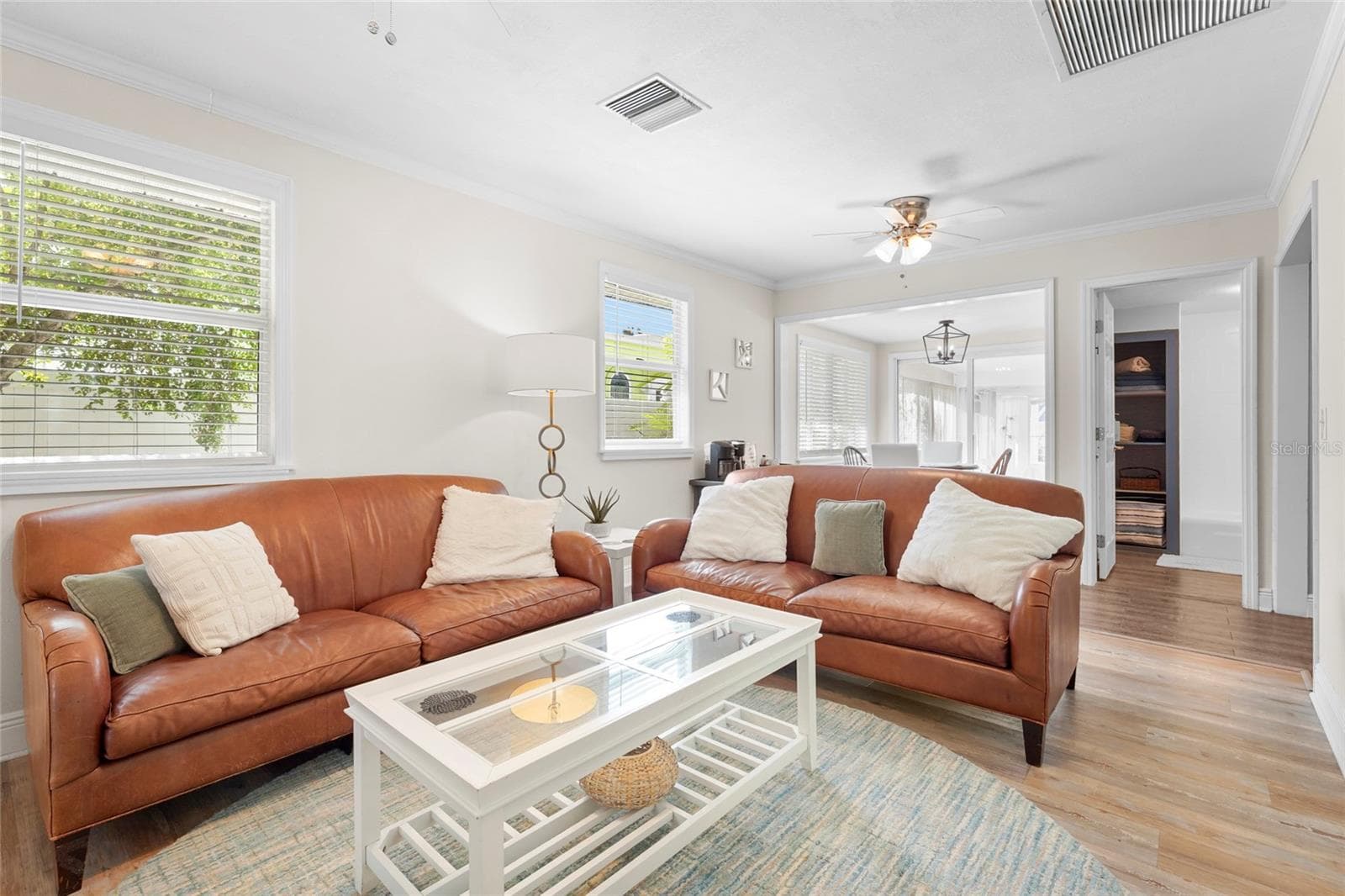 Living + Dining Flow – The living room opens into the dining area, creating a seamless connection ideal for gatherings or everyday ease. - 2705 2ND AVE W, BRADENTON