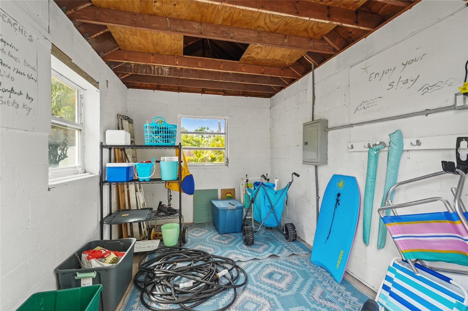 Powered Storage Shed – A spacious detached shed with double doors and electricity offers ideal storage for beach gear, bikes, tools, or even potential workshop space. - 2705 2ND AVE W, BRADENTON