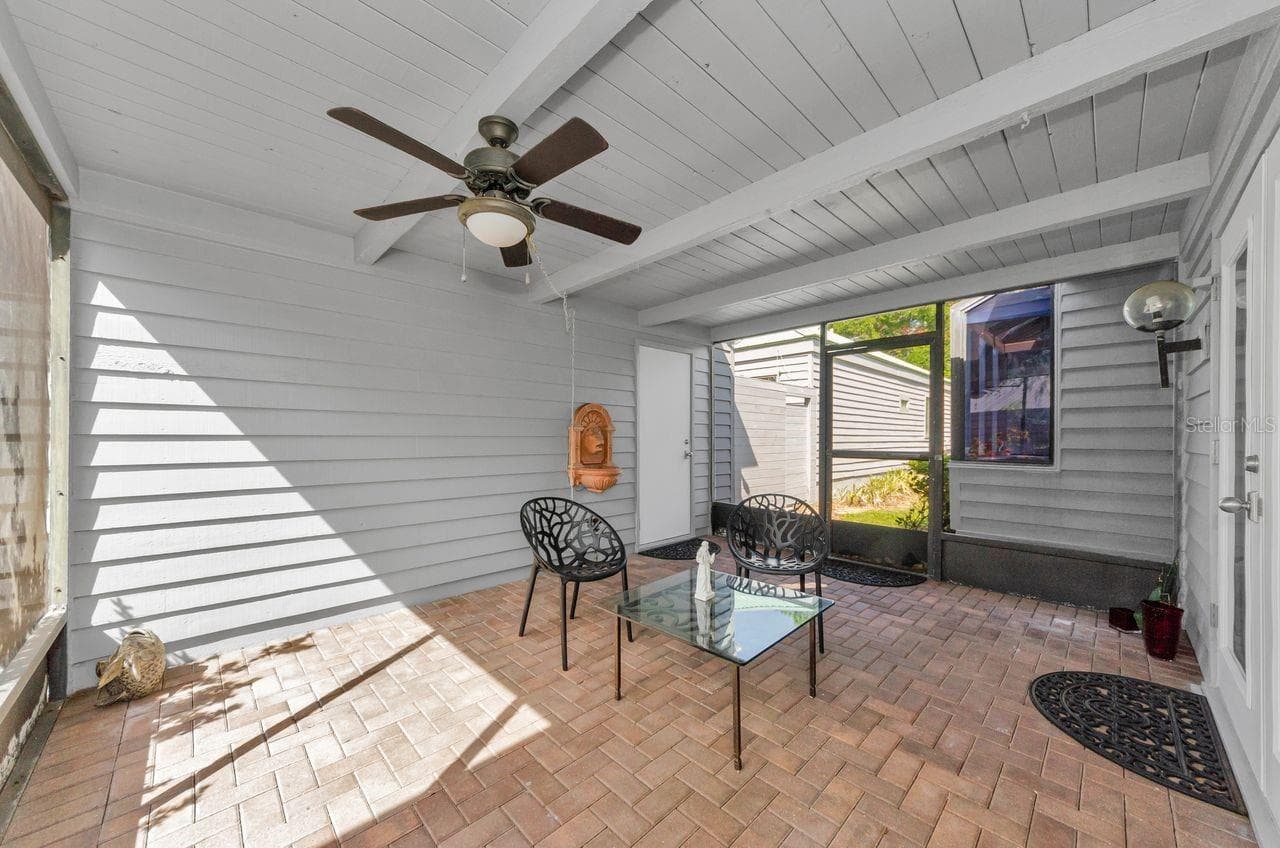 Breezeway looking at door to two car garage. - 10479 LONGWOOD DR, SEMINOLE