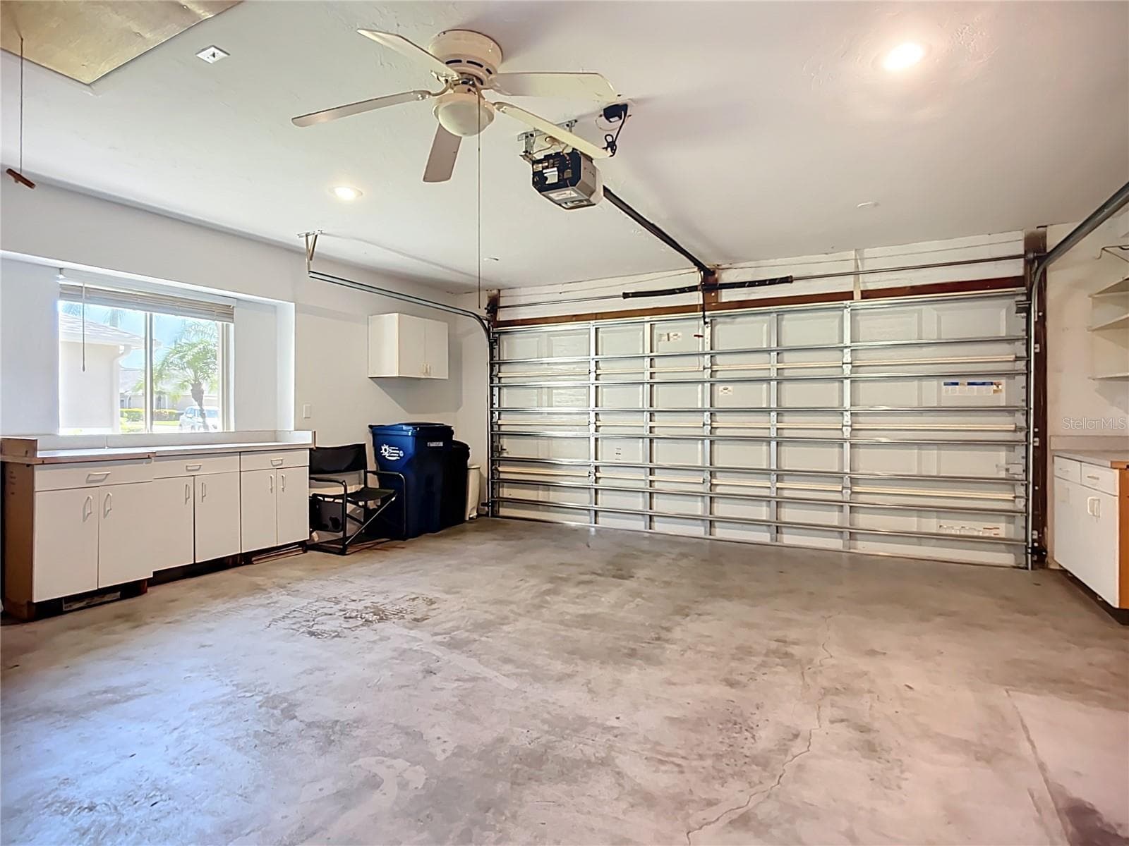 Large 2-car garage has hurricane rated door - 6948 STONEYWALK CT, BRADENTON