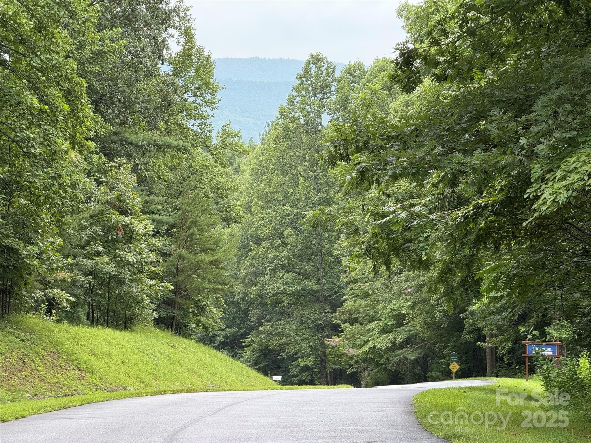 Entry road with mountains behind - Moravian Falls