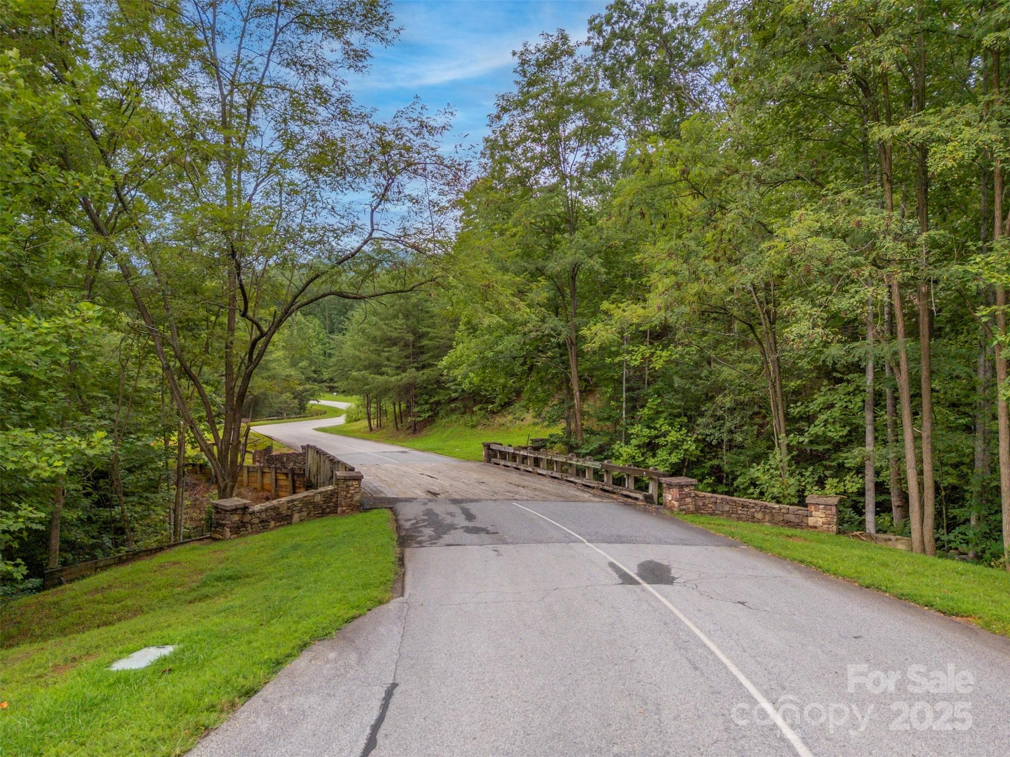 The lower (right) boundary for Lot 97 is at the bridge. - 00 Deep Gap Road E, Mill Spring