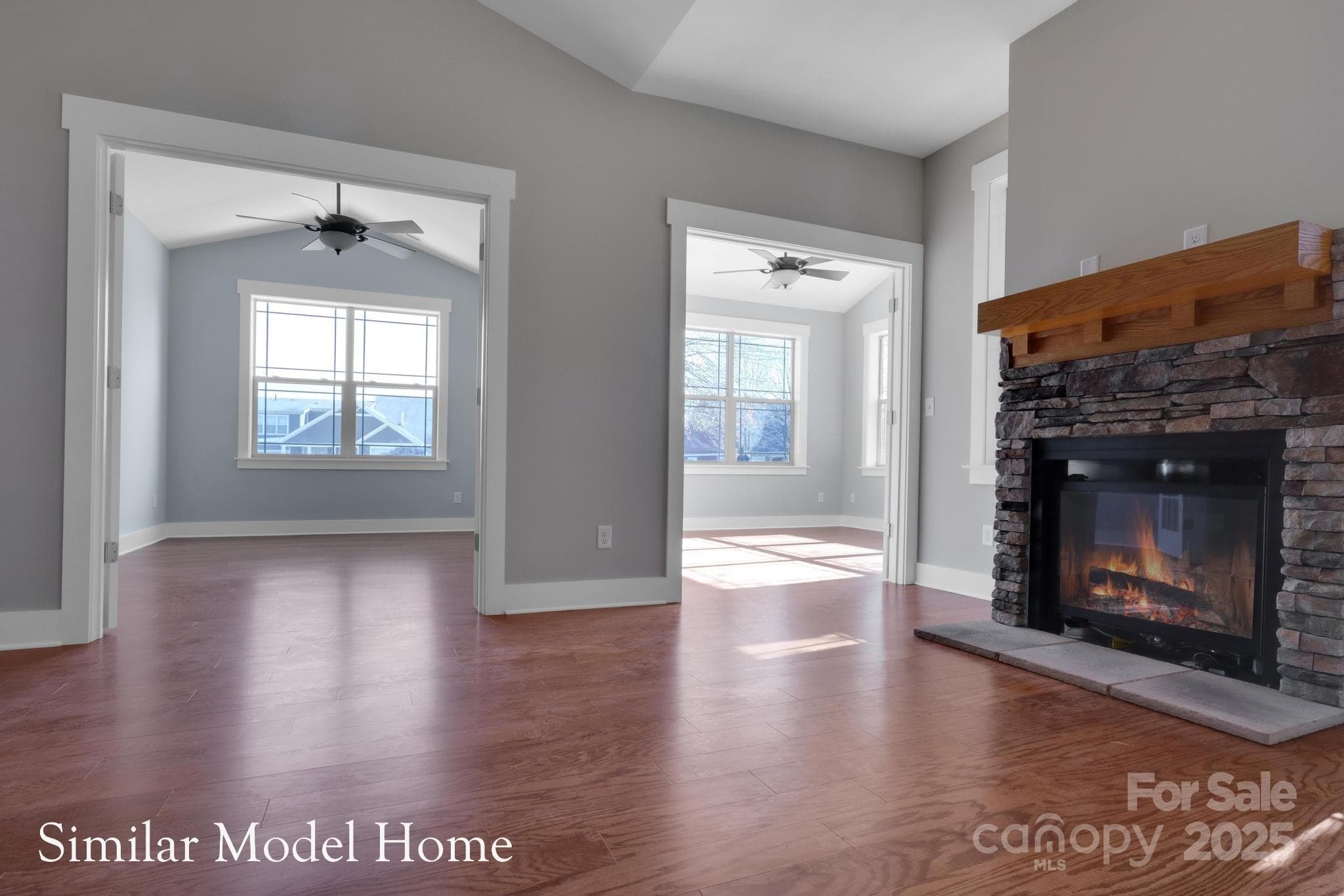Airy, vaulted living room with fireplace for warmth and charm - 9999-S-3 Brookstone Place, Candler