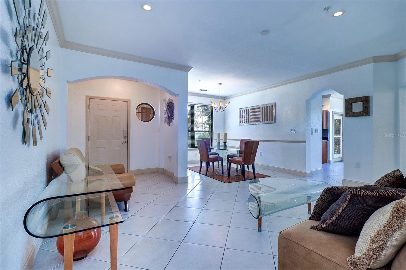 View of the foyer/entry hall, living and dining rooms - 2757 VIA CIPRIANI #1114A, CLEARWATER