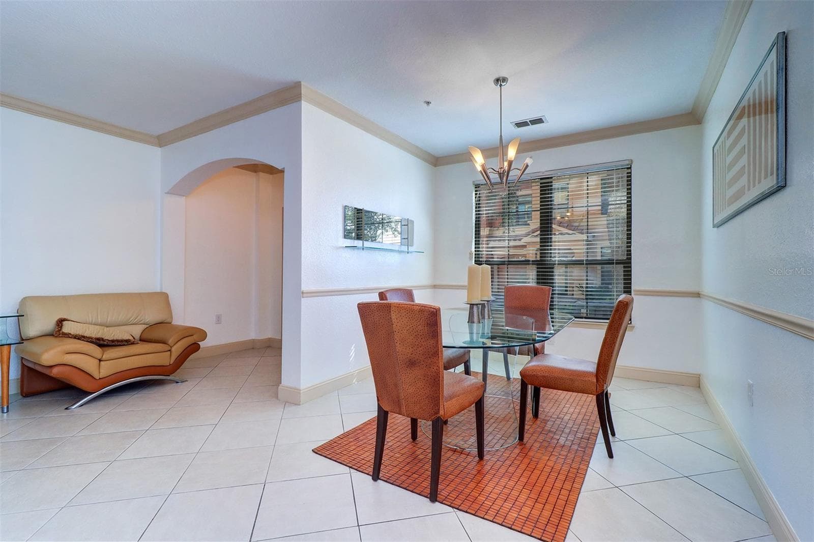 Dining room flows into the living room area to the left - 2757 VIA CIPRIANI #1114A, CLEARWATER
