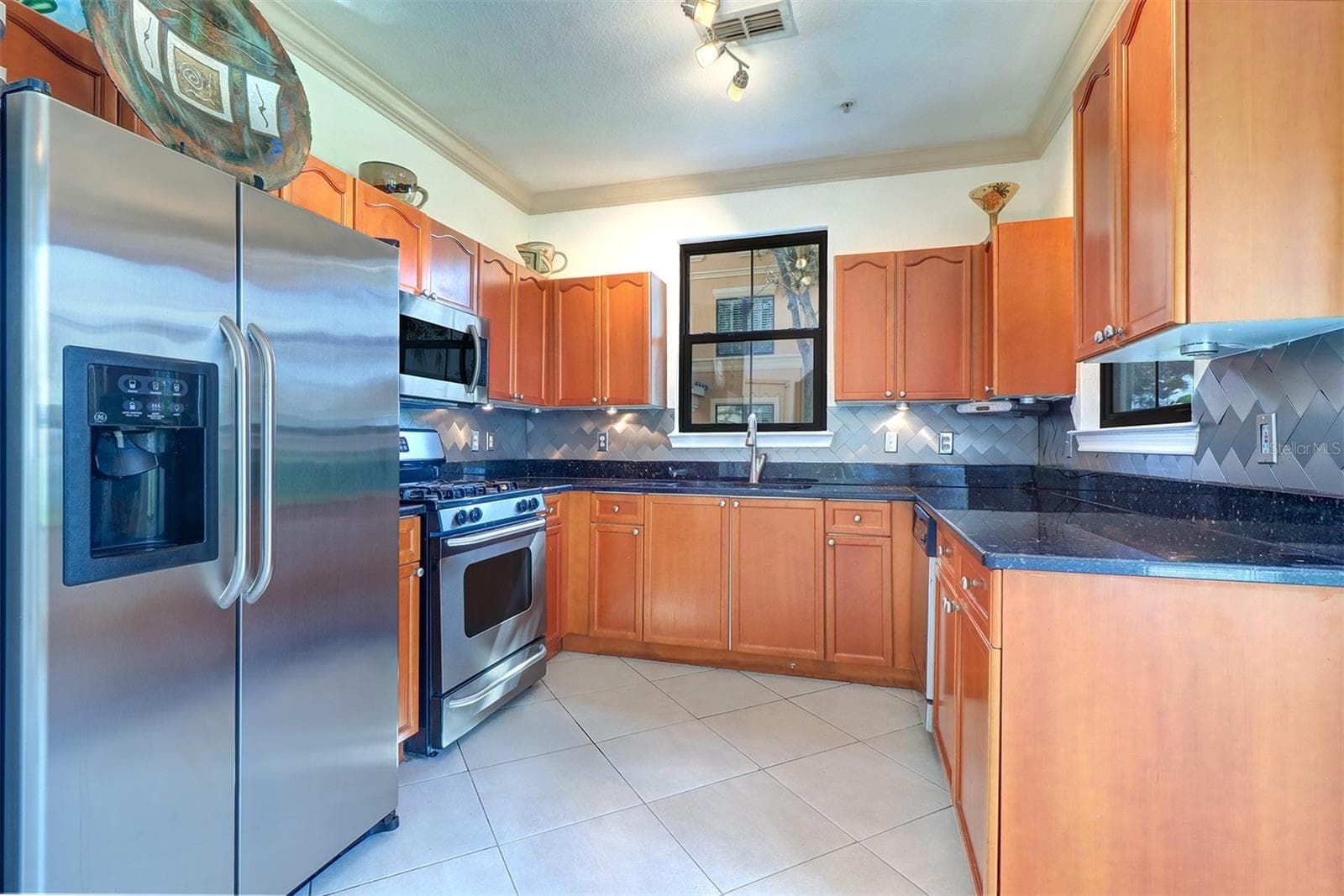 Light and bright kitchen with water views from either window as you cook! - 2757 VIA CIPRIANI #1114A, CLEARWATER