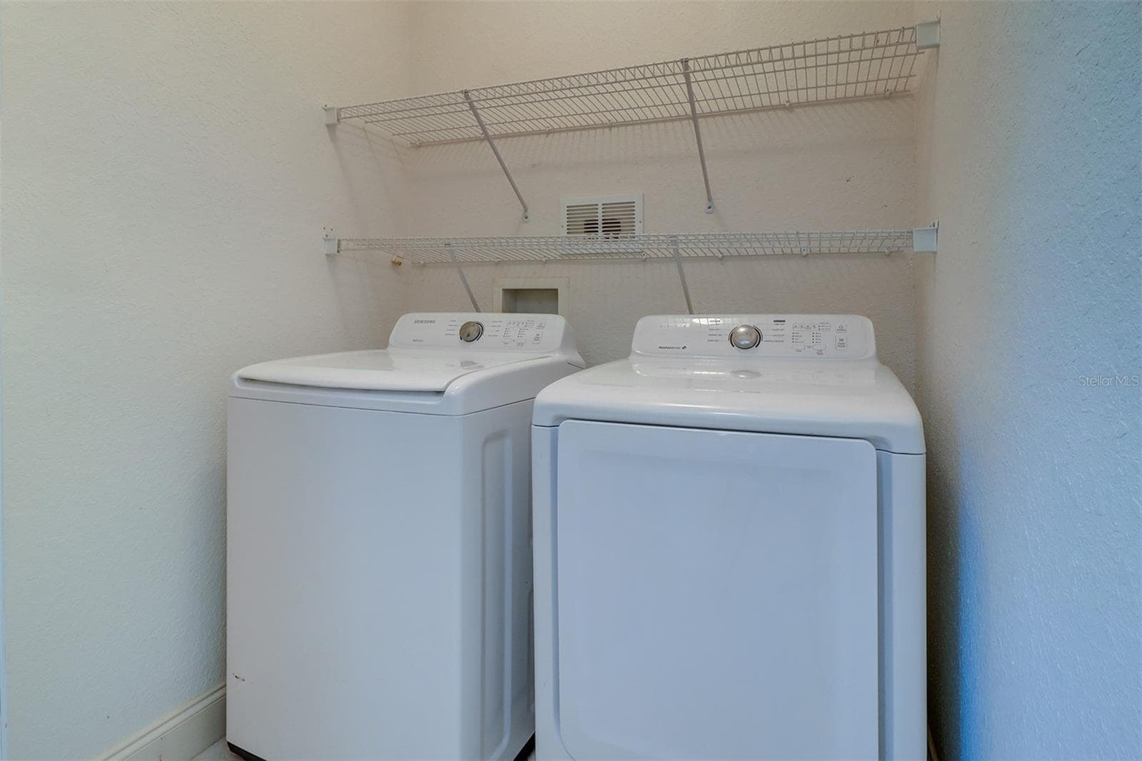 Utility room with full size washer and dryer and shelving - 2757 VIA CIPRIANI #1114A, CLEARWATER