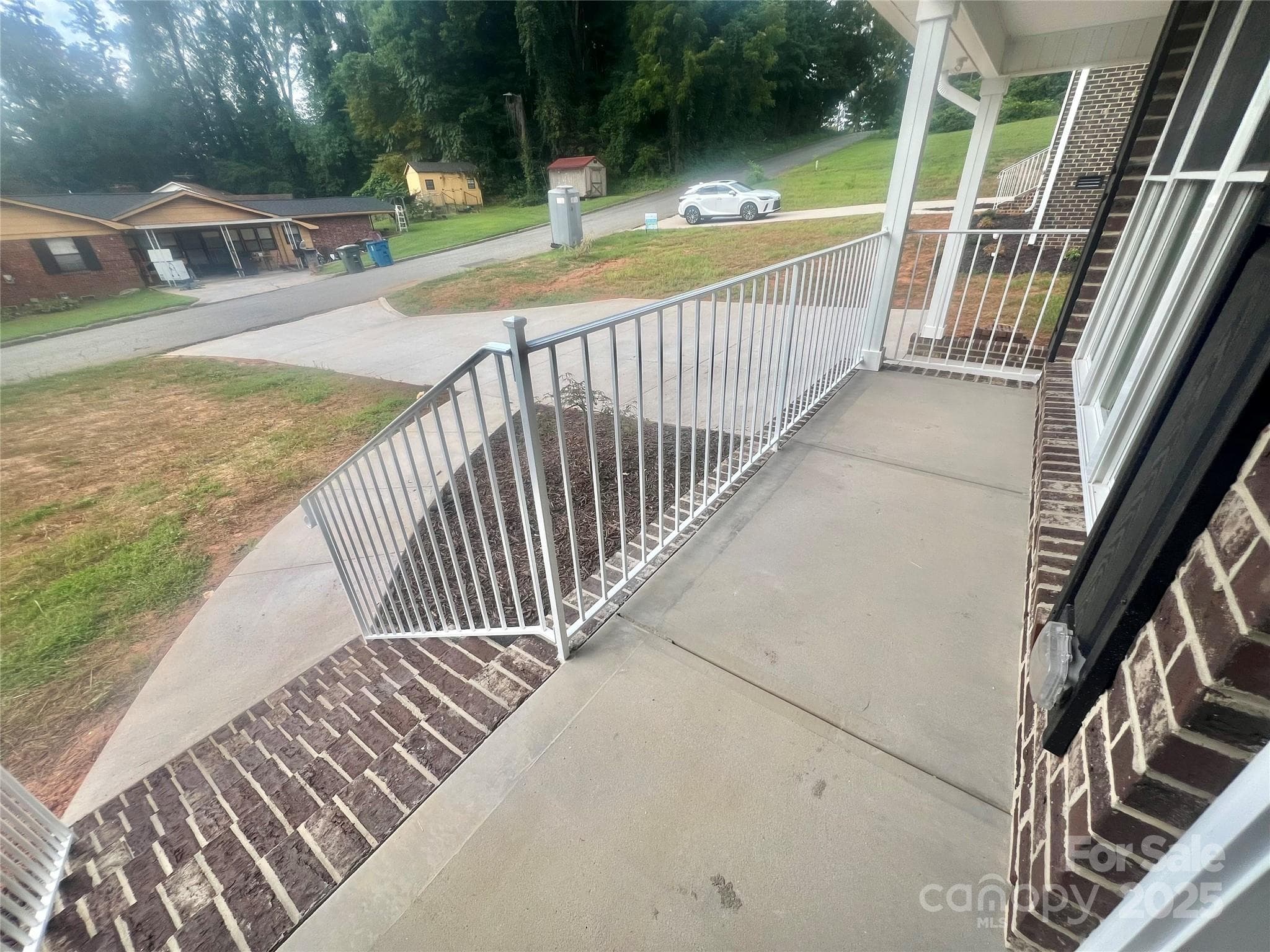 Nice Concrete front porch, Metal handrailing - 1280 N Shaver Street, Salisbury