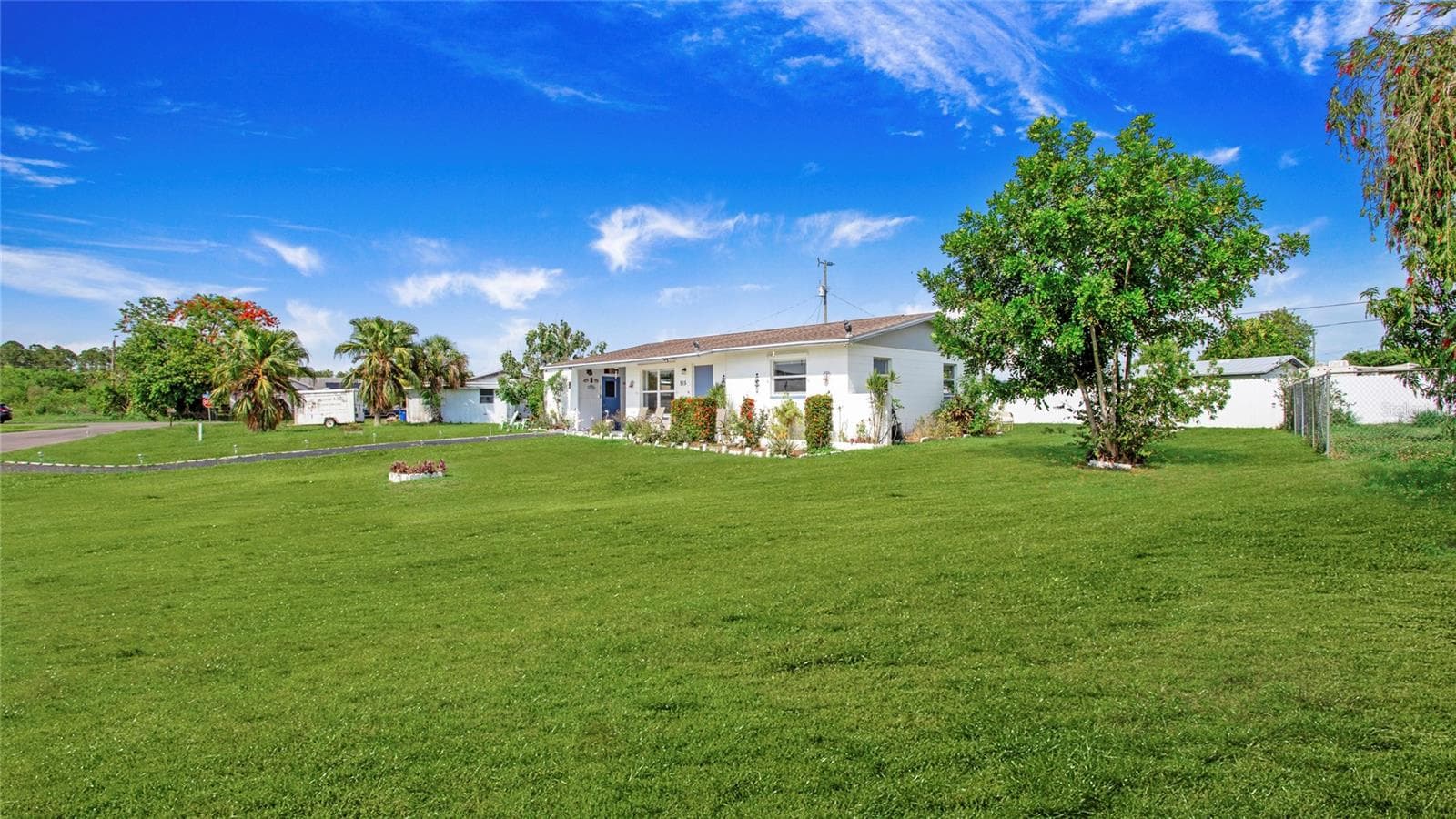 Backyard with various frut trees - 515 YORK RD, LEHIGH ACRES