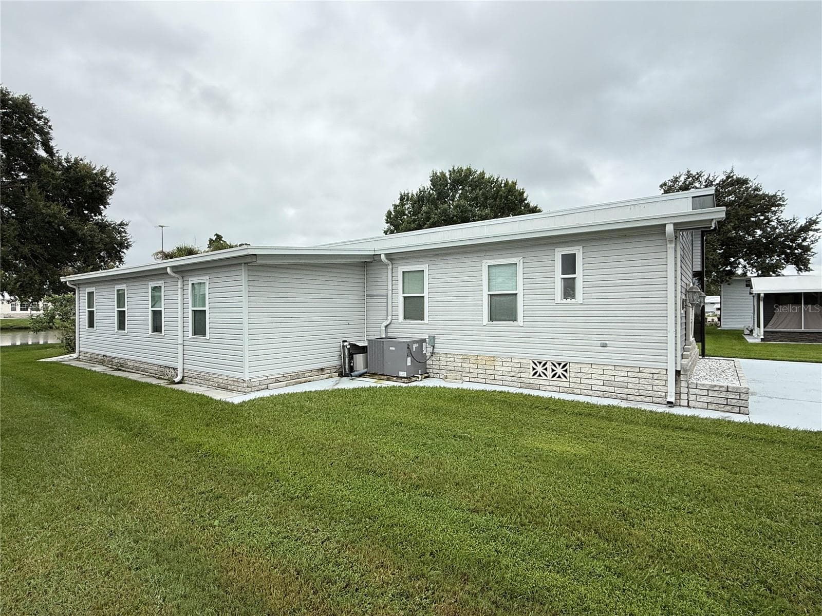 Manufactured Home at 4995 MOUNT OLIVE SHORES DR, POLK CITY, photo 6 of 75