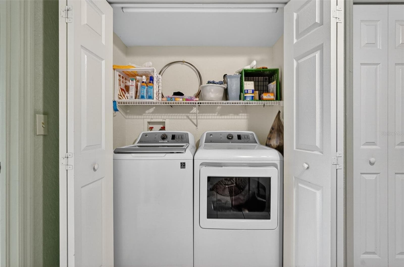 Convenient upstairs laundry between the two primary suites - 14879 SEMINOLE TRL, SEMINOLE